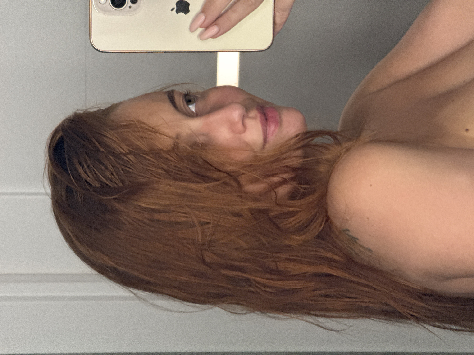 Mirror selfies and shelf decor in a Chaikovsky interior