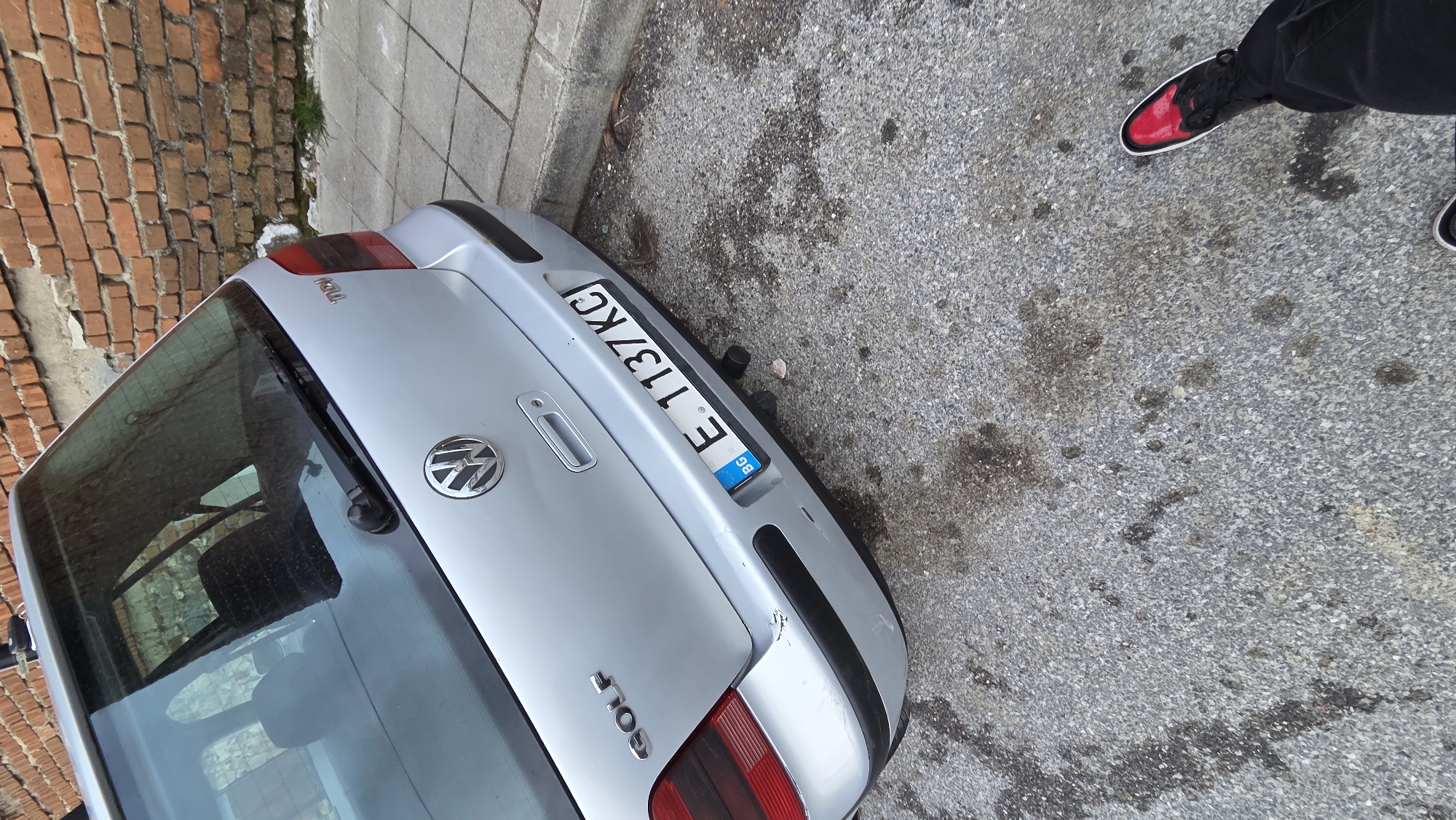 Silver Volkswagen Golf parked on street in Bania, Bulgaria