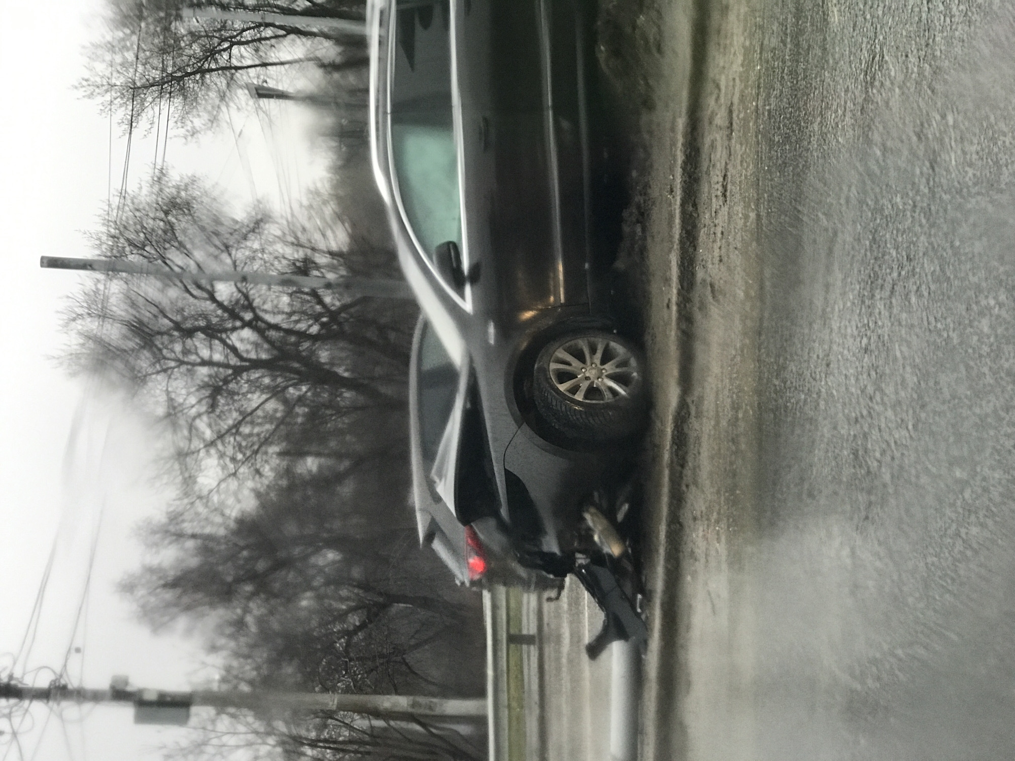 Damaged vehicle with rear-end impact observed roadside in Perm