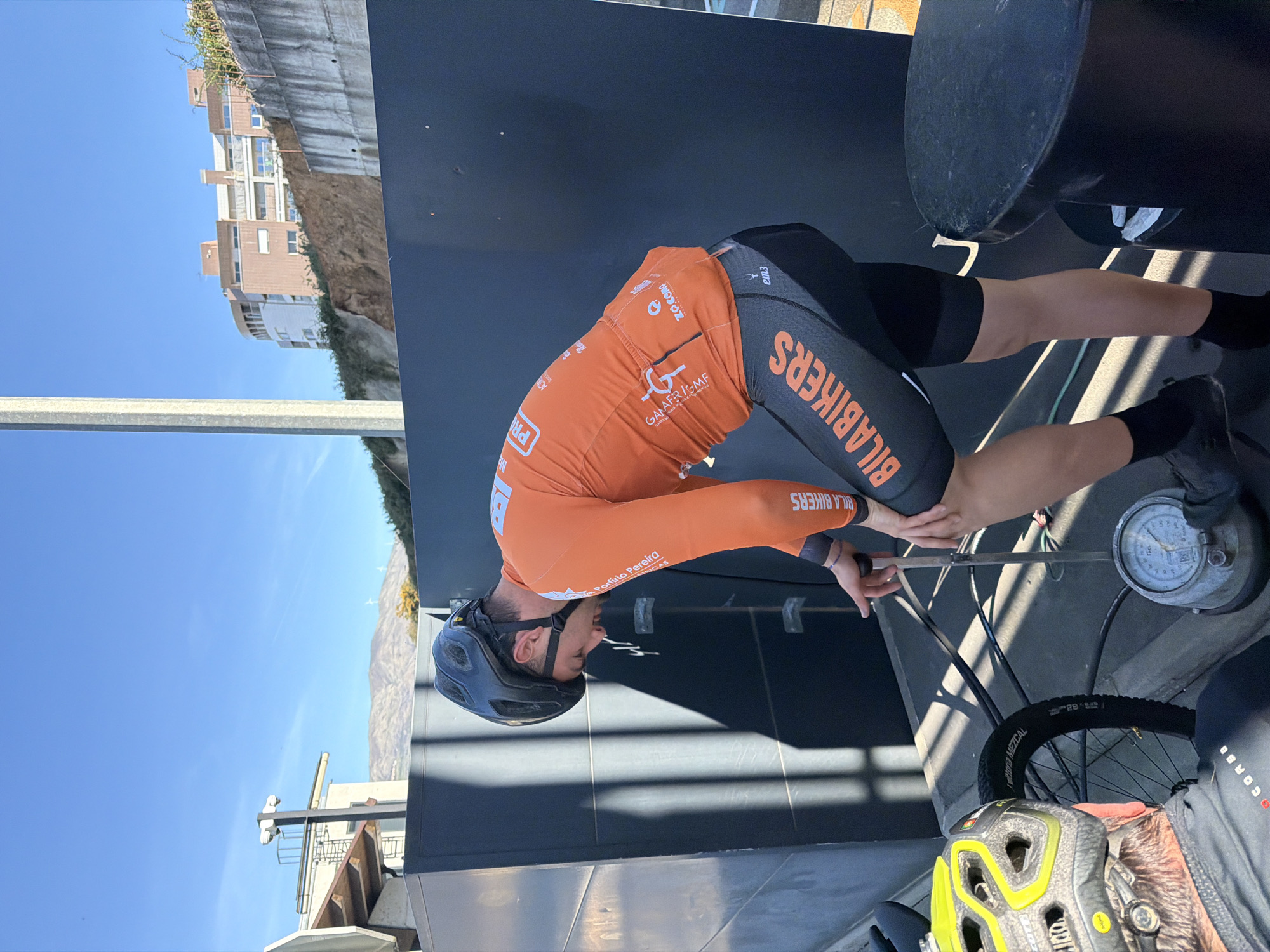 Cyclists examine structure at Vila Real toll booth