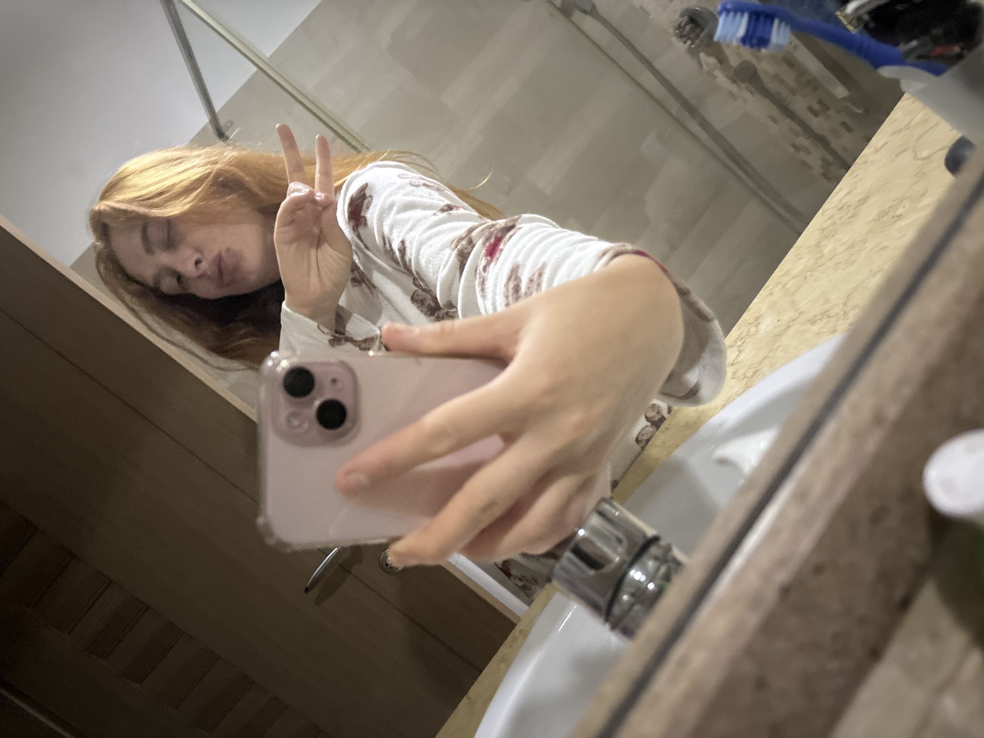 Woman takes bathroom selfies in pajamas in Montenegro