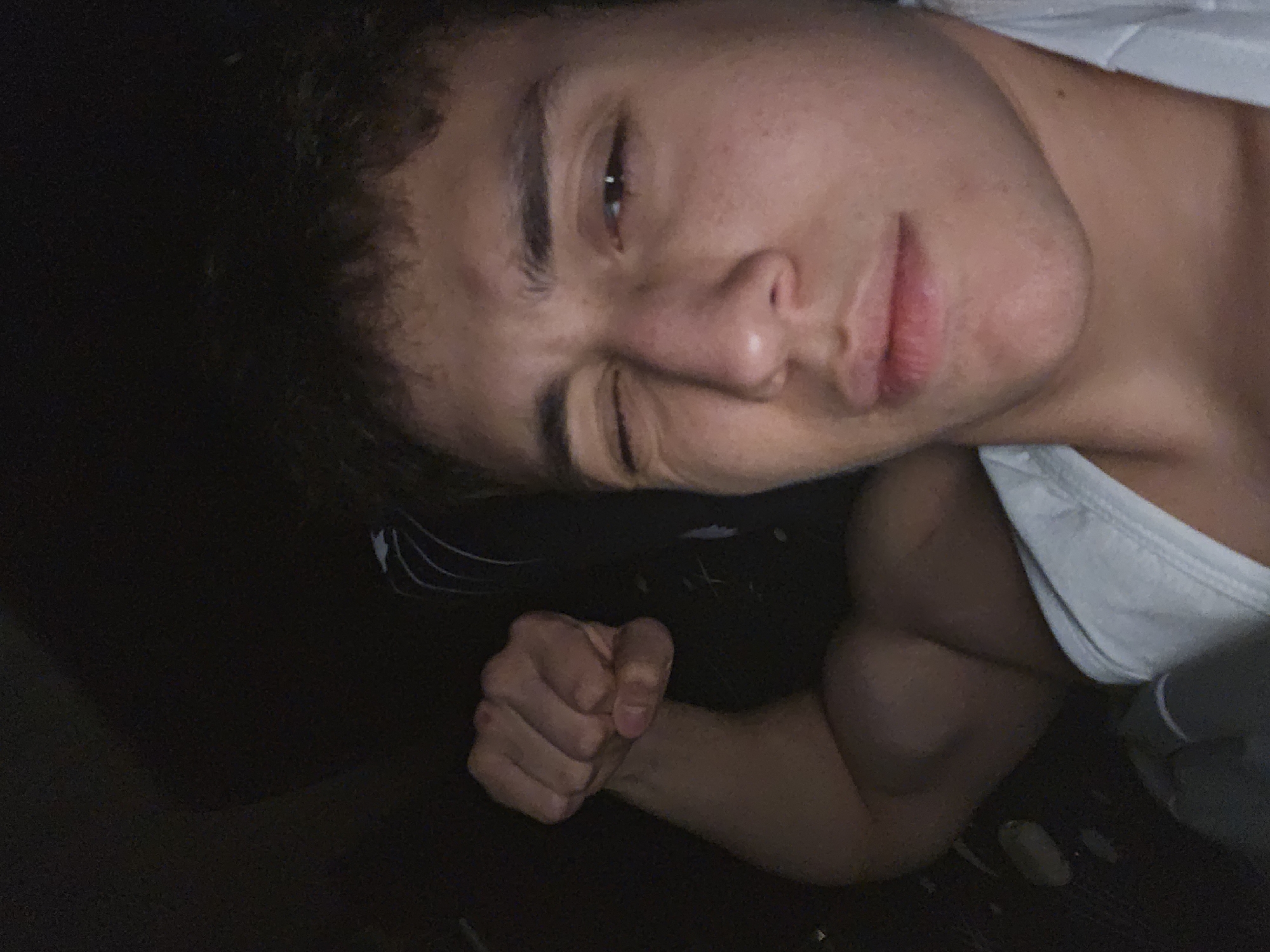 Young man takes playful flexing selfie in Yerevan