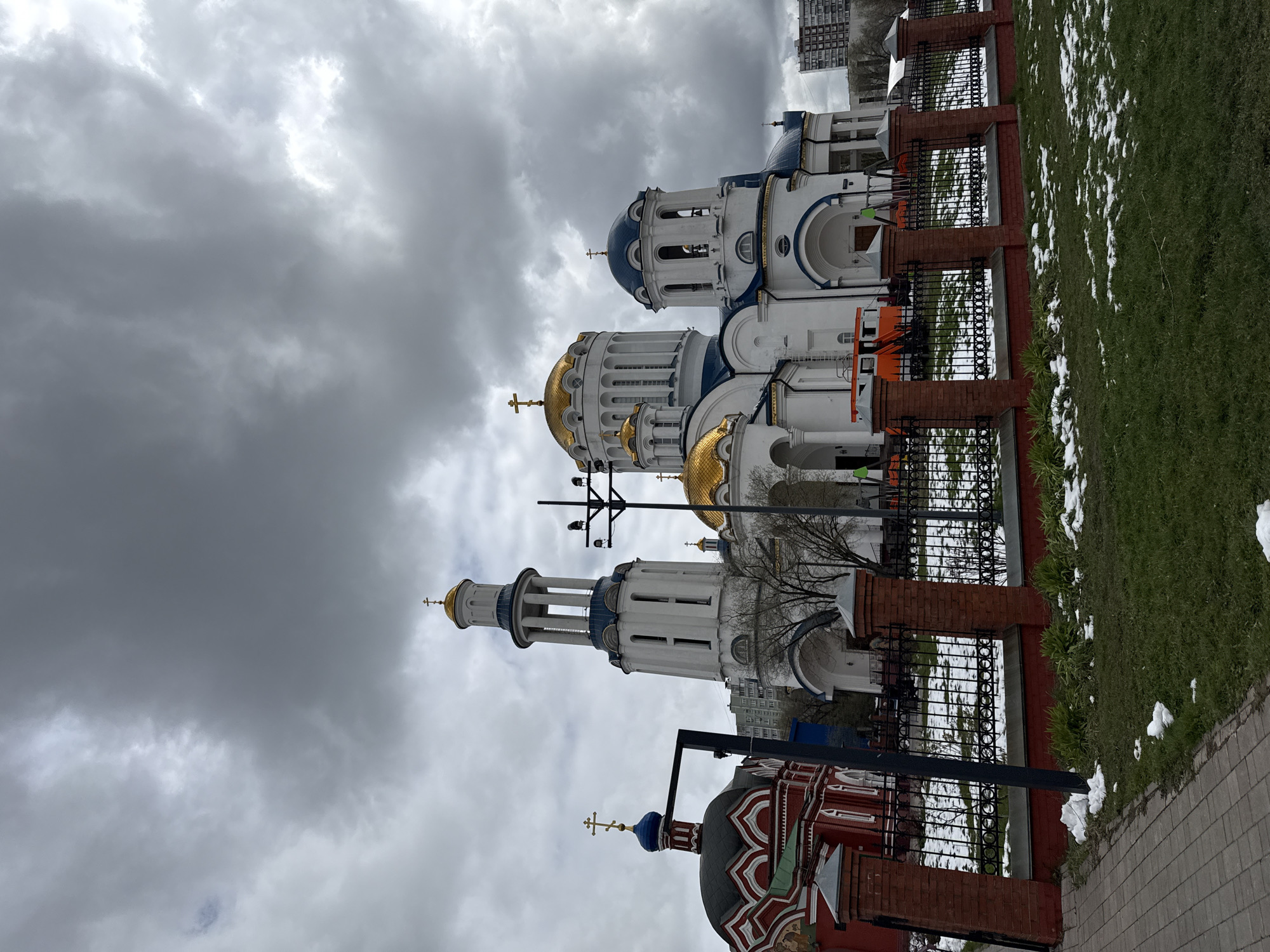 Orthodox churches with onion domes observed under gray Moscow sky