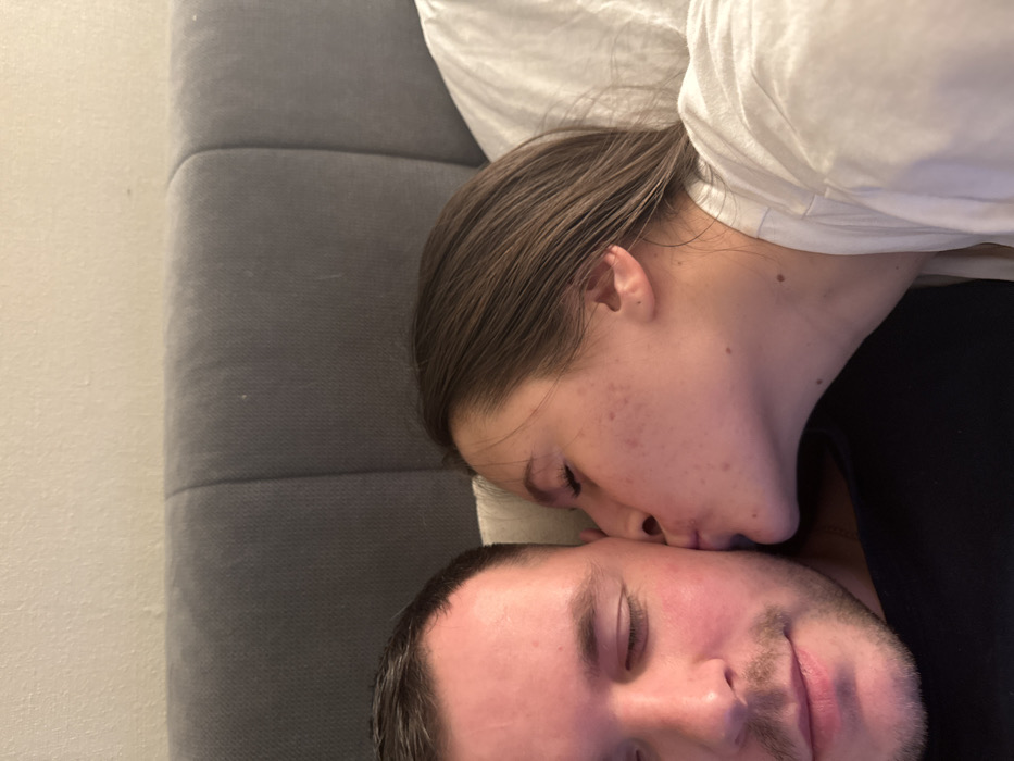 Couple enjoys quiet evening at home with cat in Odintsovo
