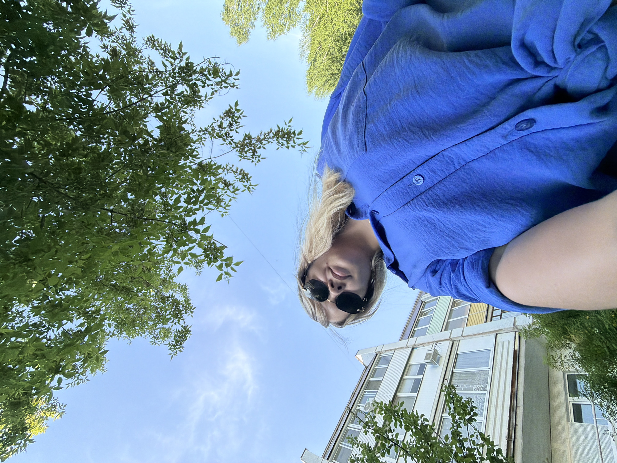 Woman documents spring afternoon with selfies and flowers in Chaikovsky