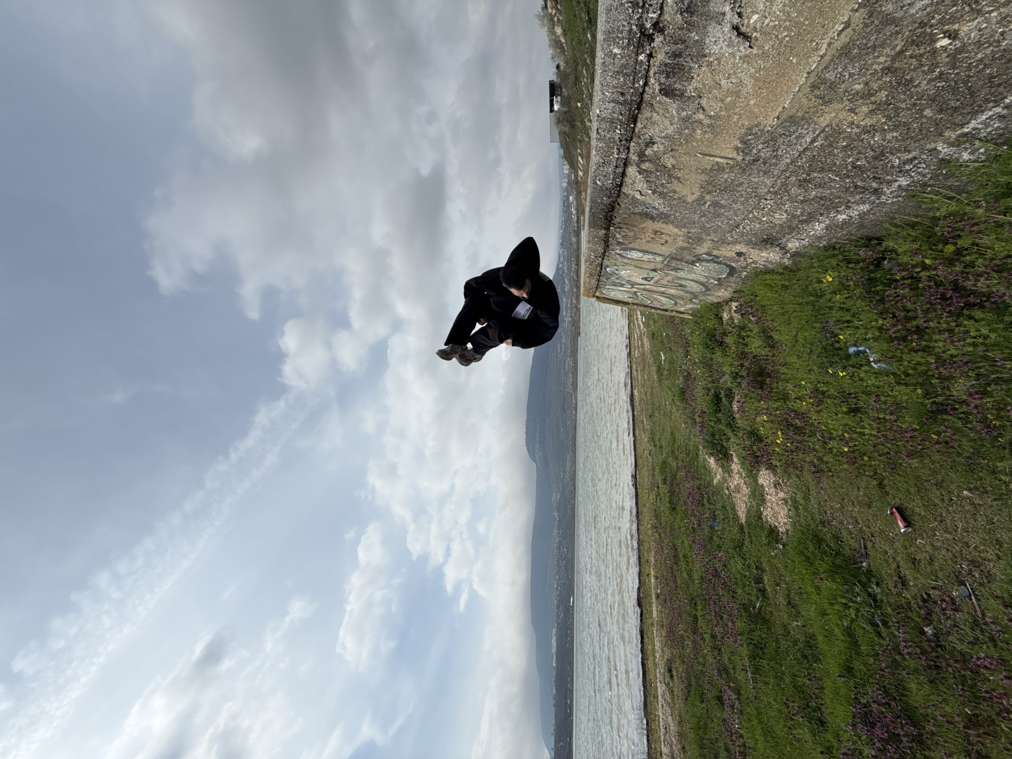 Person performs acrobatics at Bulgarian waterfront during afternoon outing