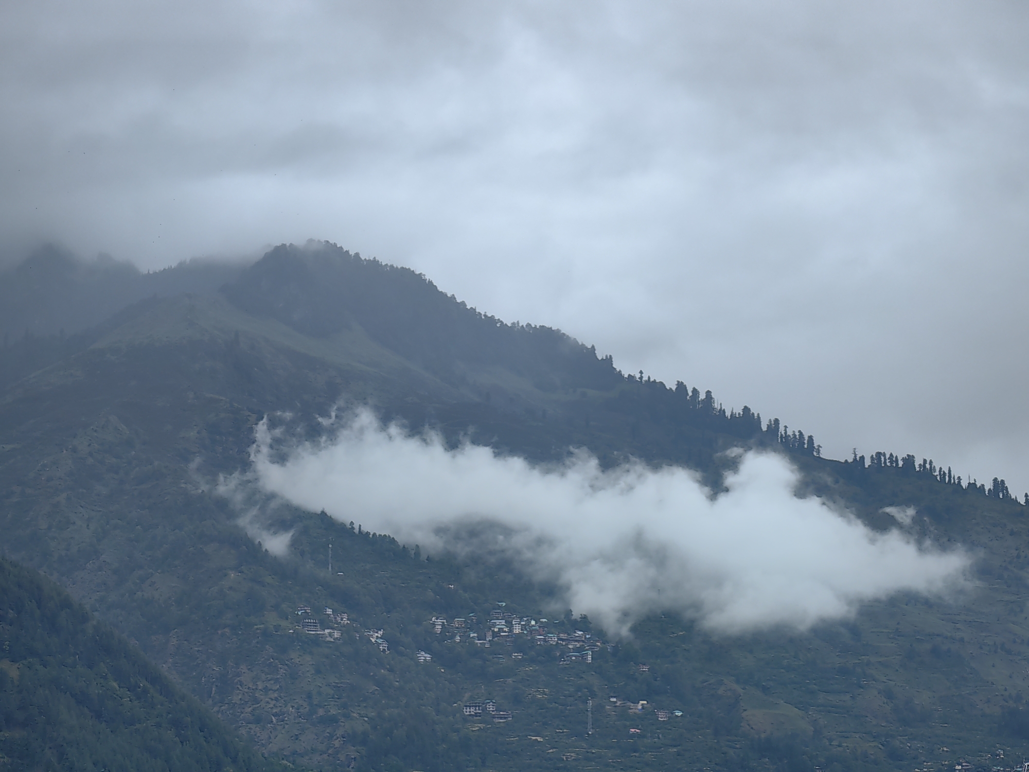 Early morning clouds shroud Vashisht mountain village