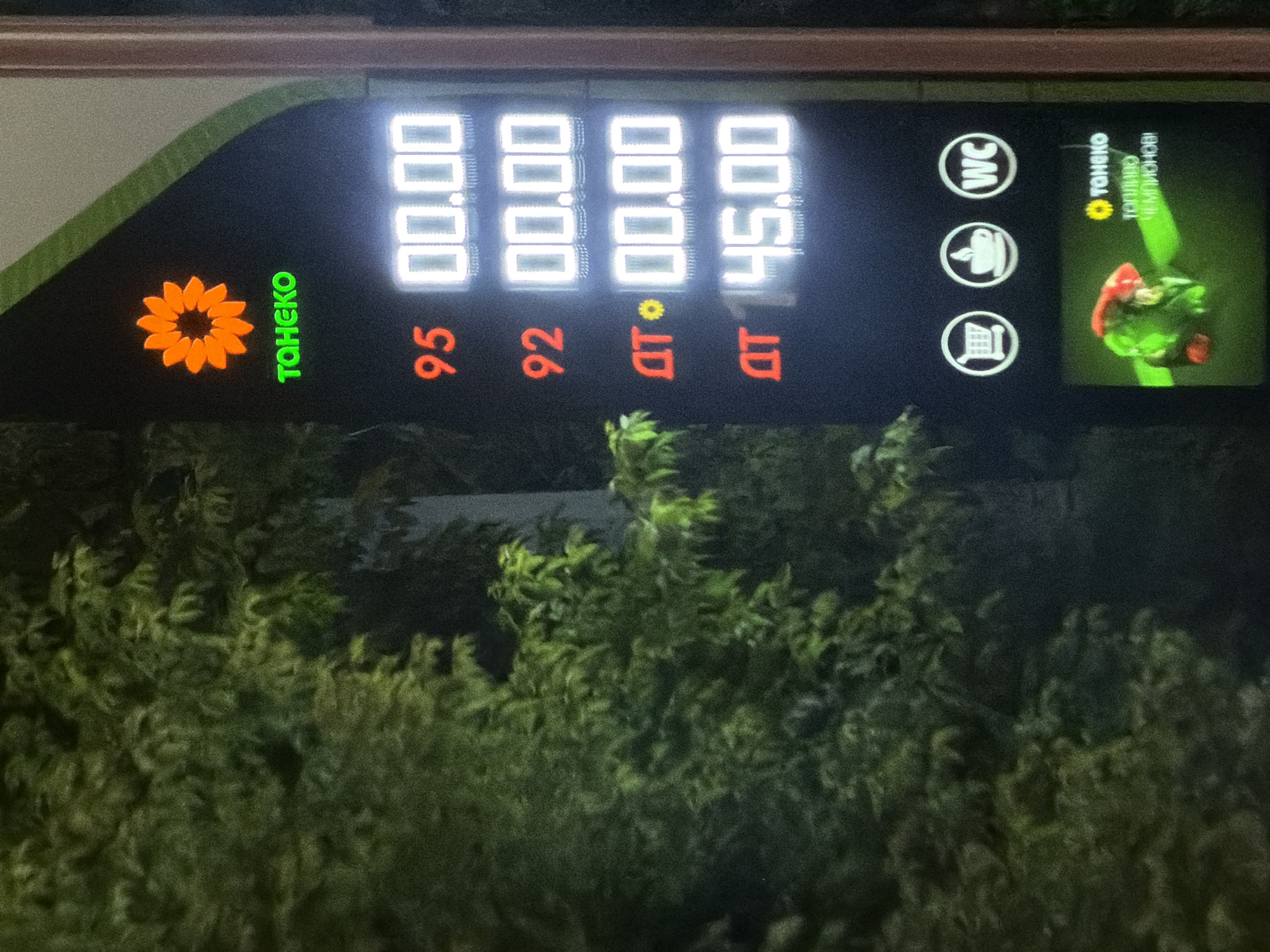 Nighttime fuel prices on a gas station board in Vereya