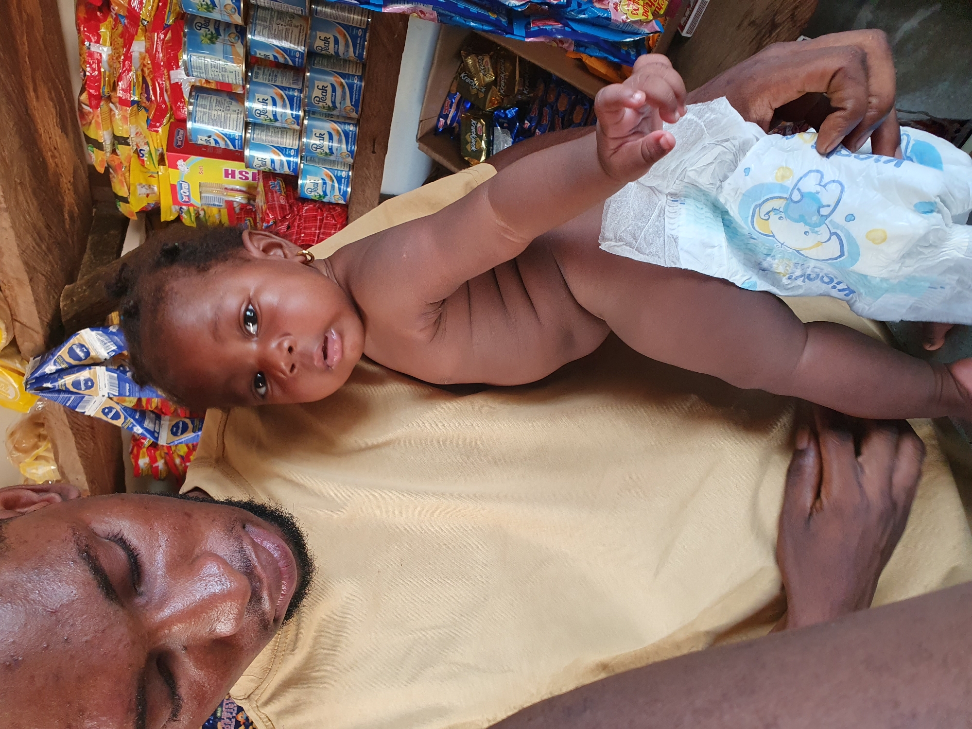 Family life unfolds in small shop in Lokoja, Nigeria