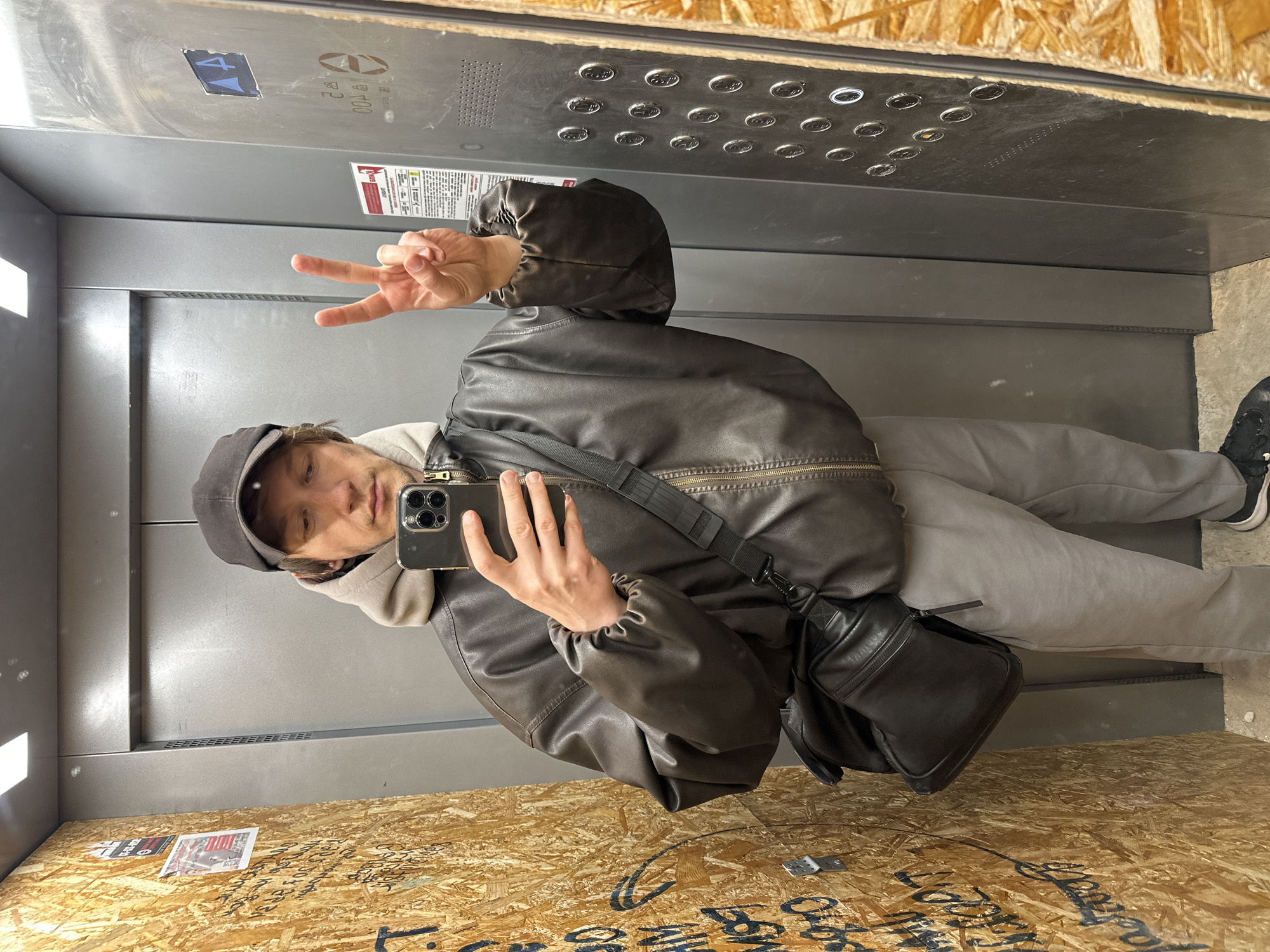 Person takes selfie in elevator in Russia