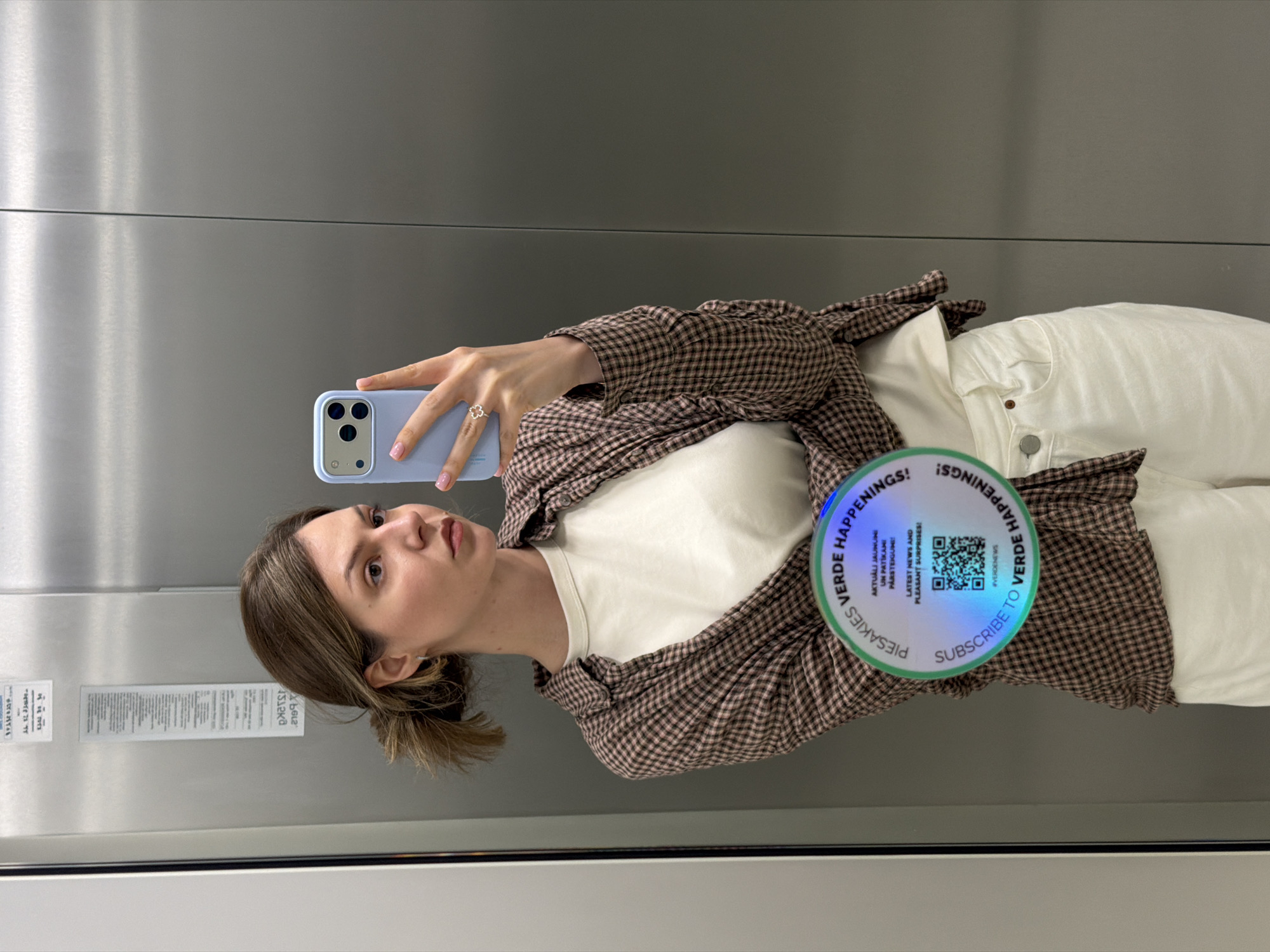 Inside a Riga building — elevator selfie and marble lobby floor