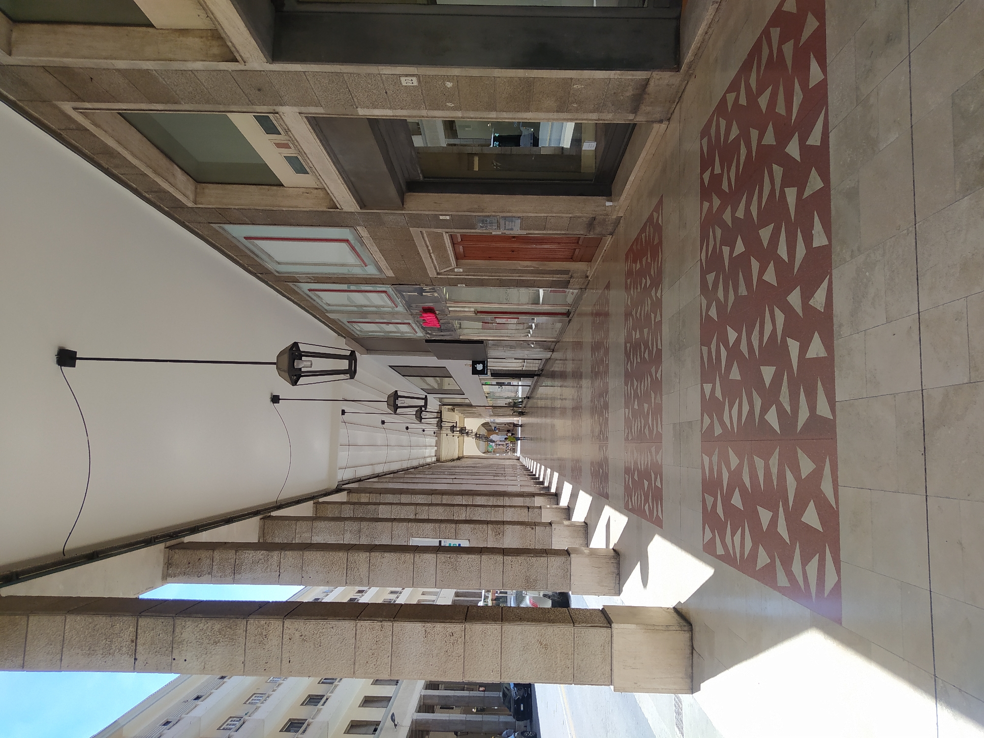 Porticoed walkway along Via Grande in central Livorno