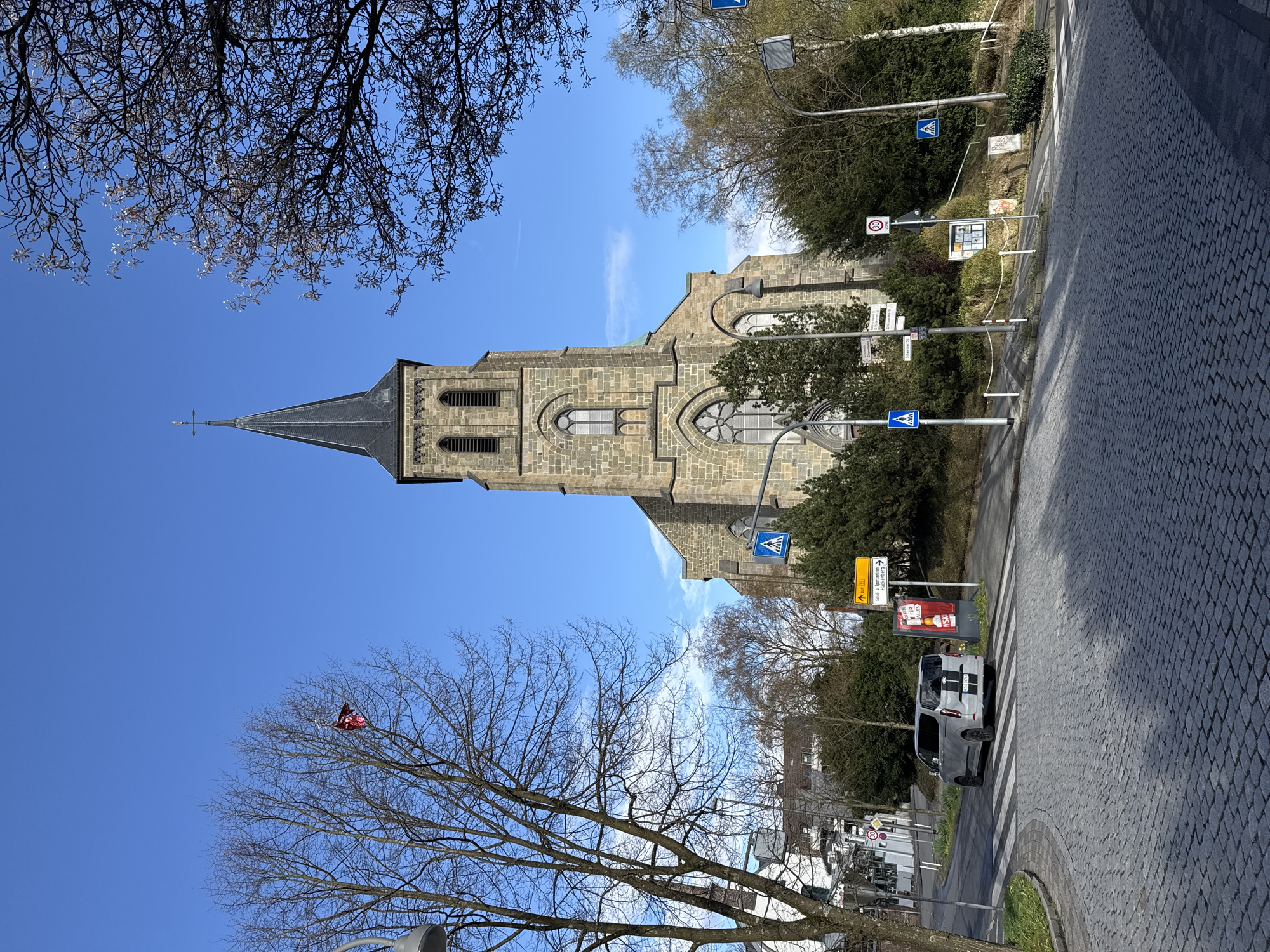 Tourist documents historic Remscheid architecture and landmarks during afternoon stroll