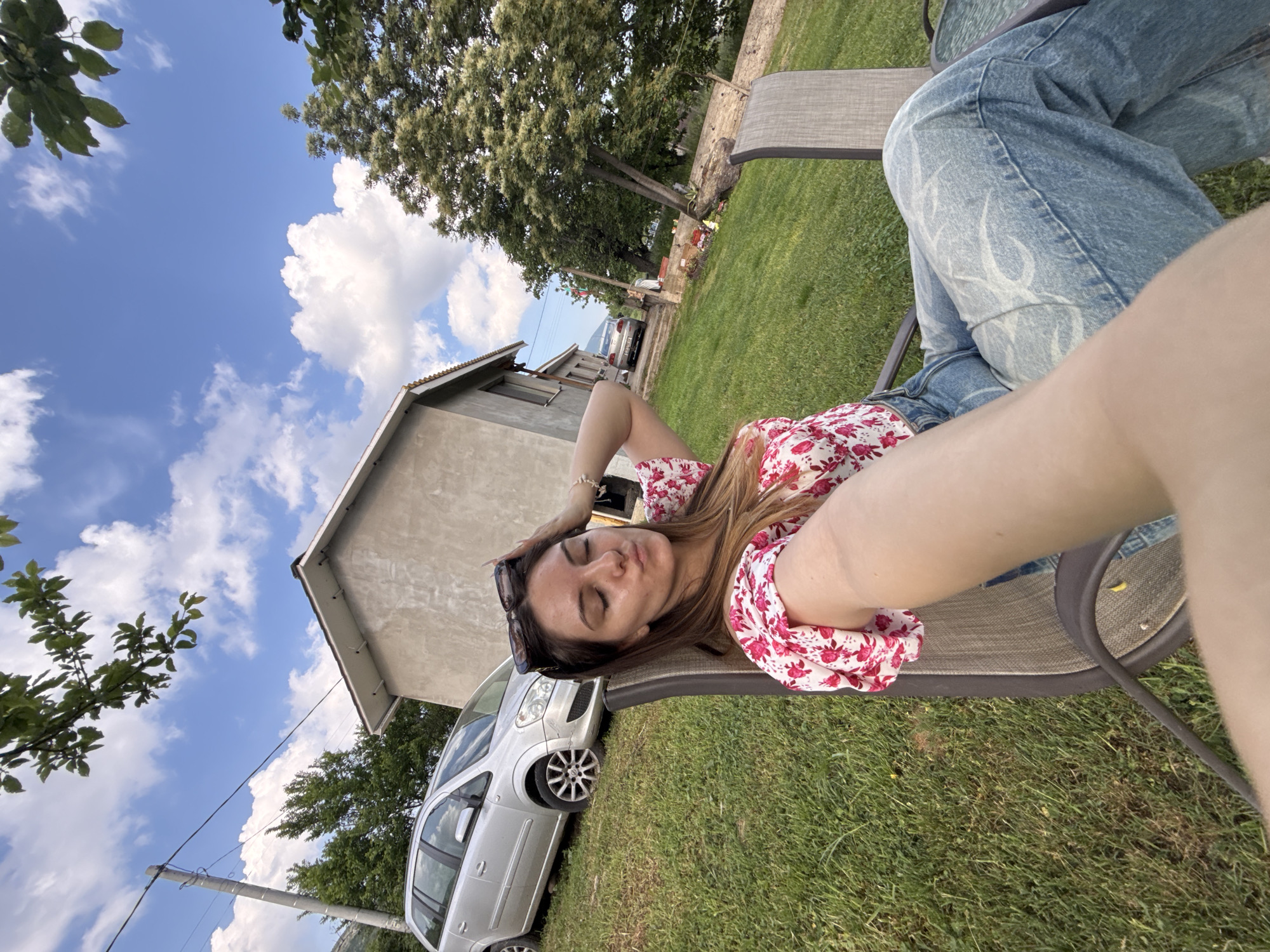 Woman relaxes in backyard setting in Sliven, Bulgaria