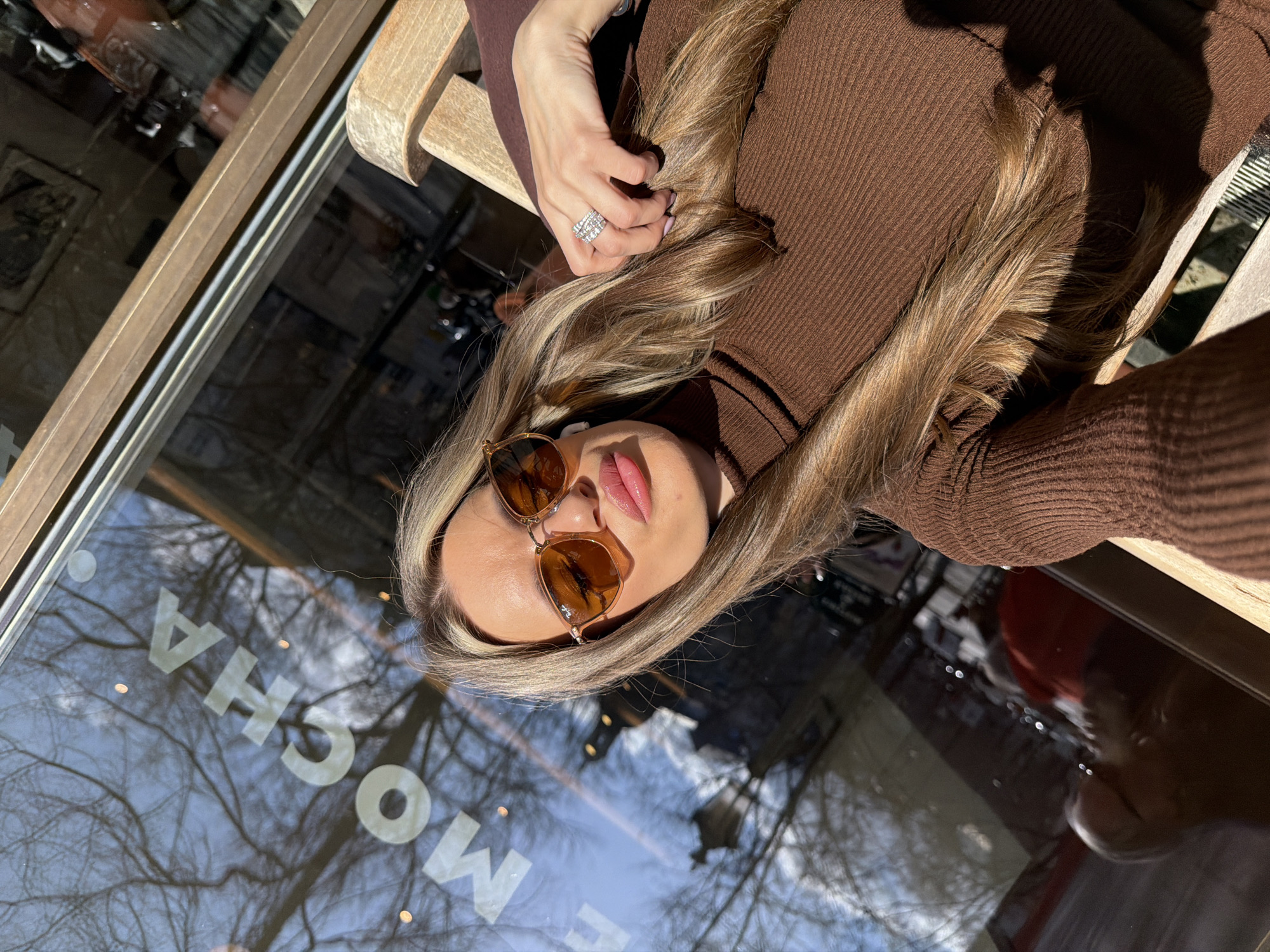Woman enjoys afternoon at Berlin café with outdoor seating