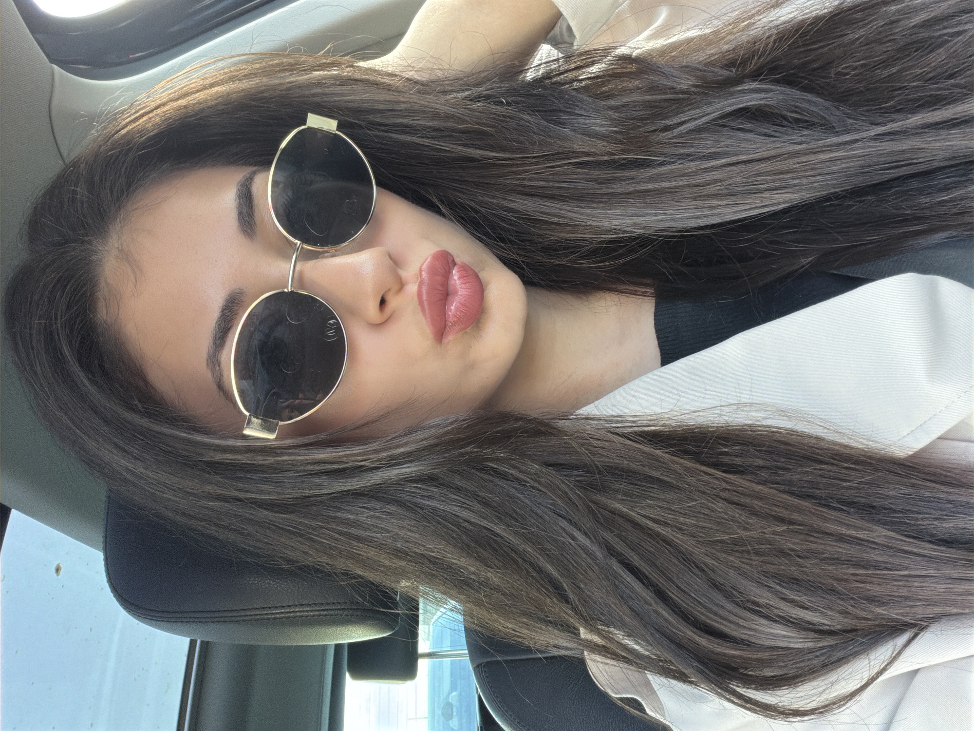 Woman in sunglasses observed in car in Sofia