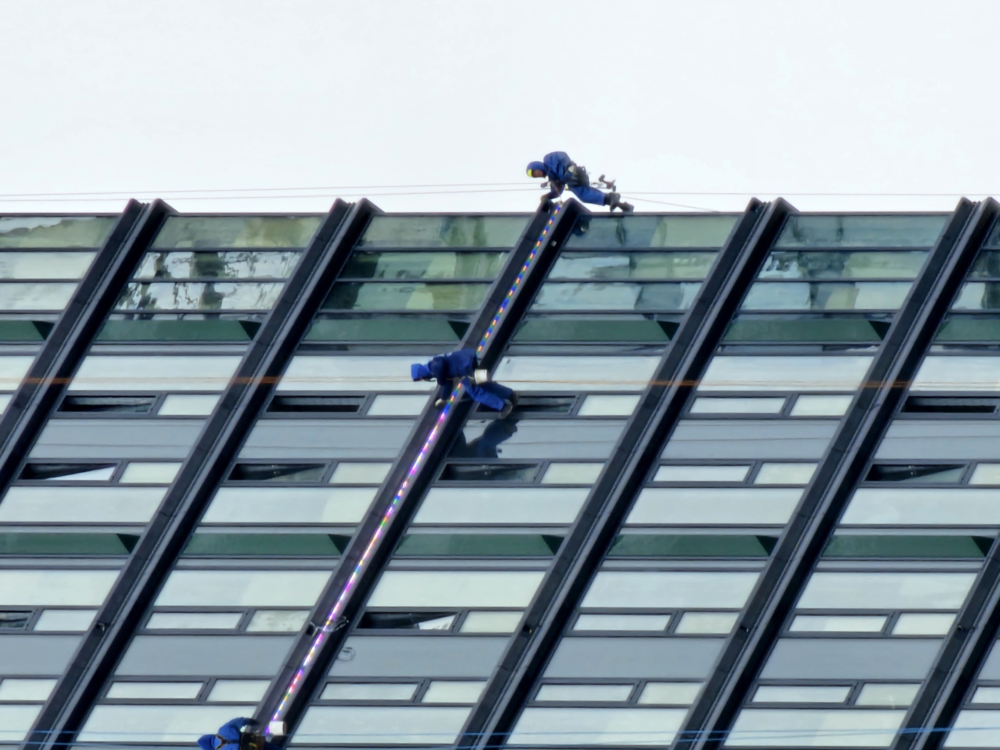 Window cleaning crew works high-rise glass facade in Moscow