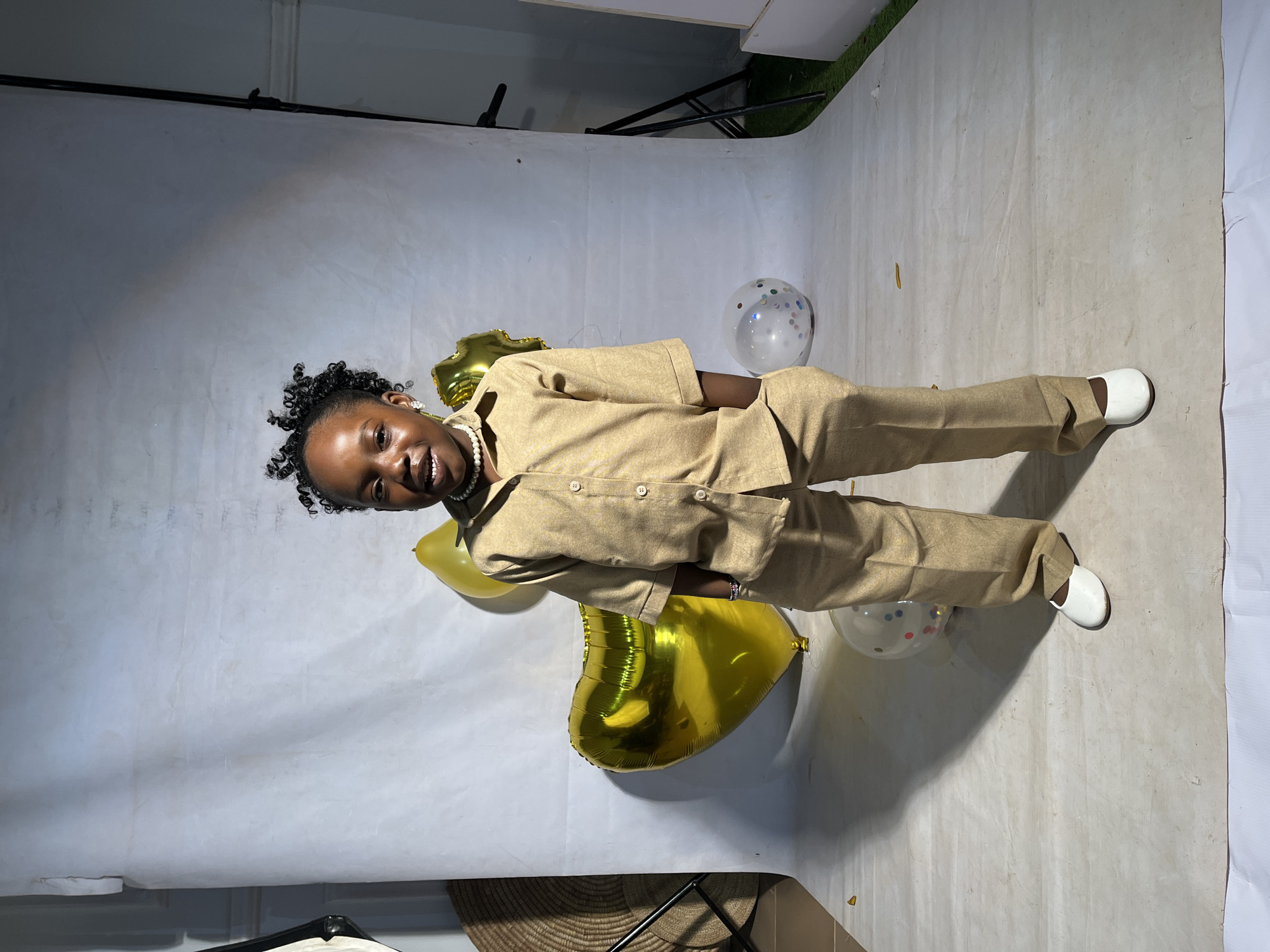 4th birthday studio shoot with gold balloons, Nigeria
