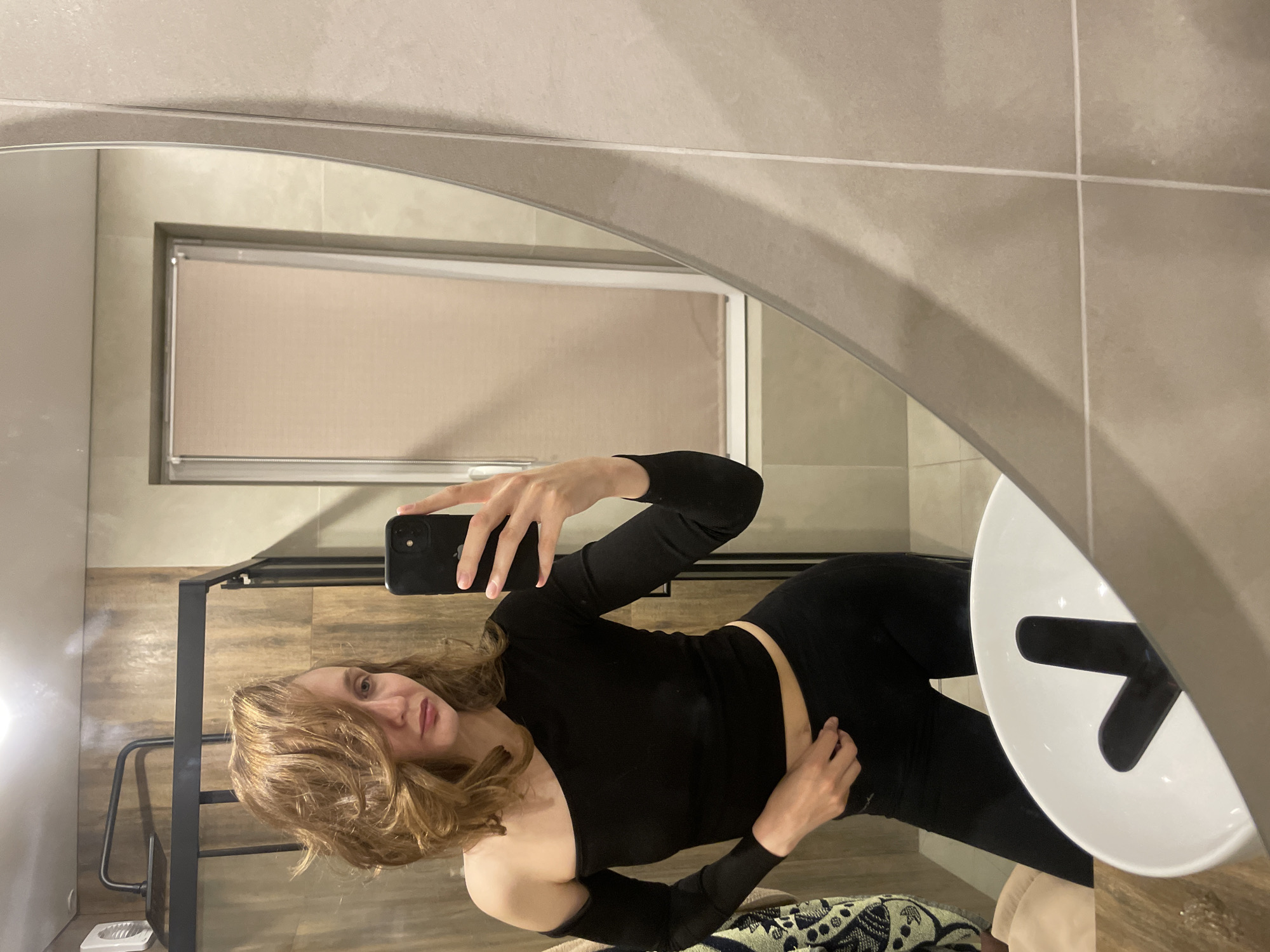 Woman takes bathroom mirror selfie in Russian forestry district