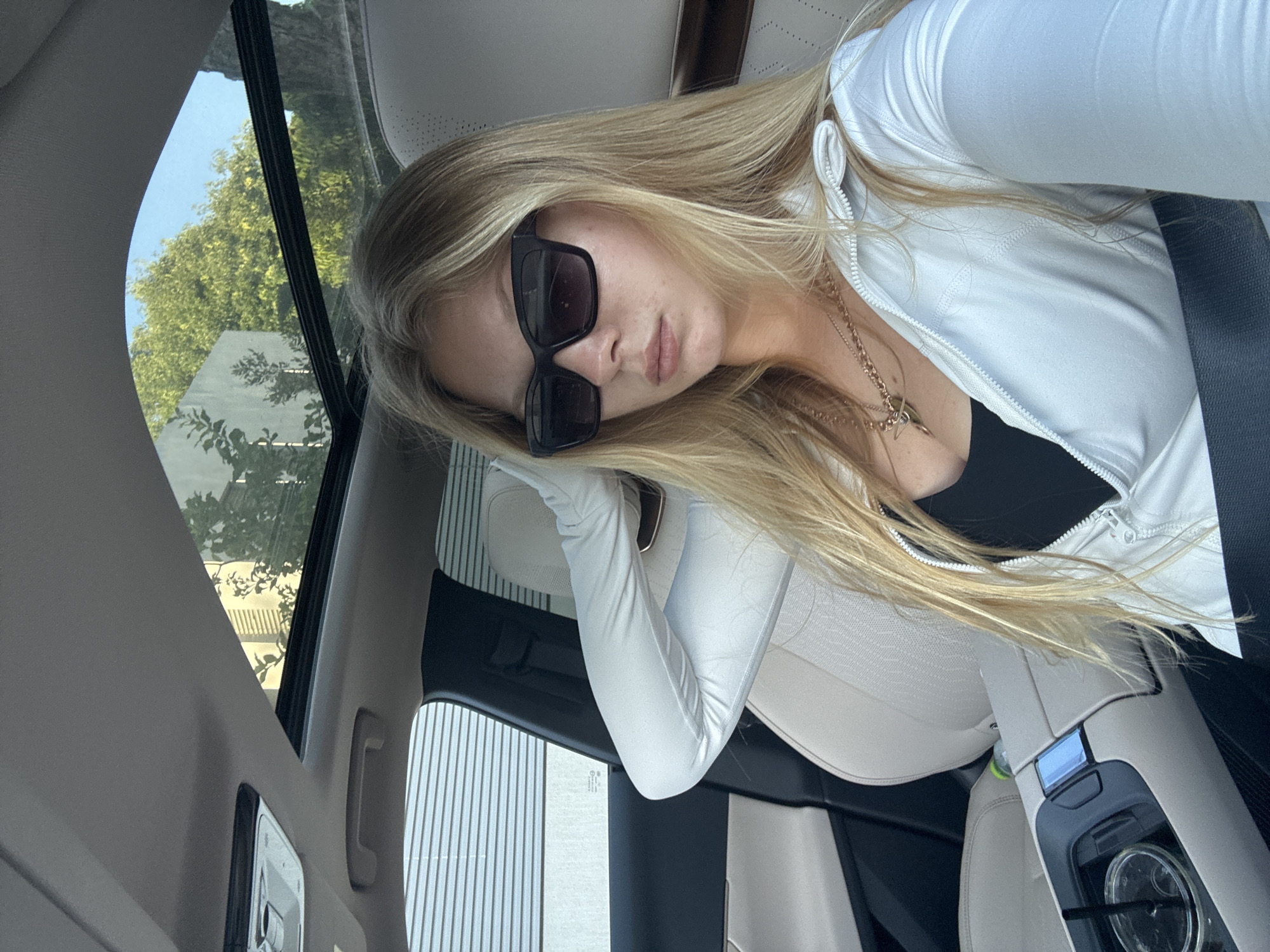 Woman photographed in car passenger seat in Kfar Shmaryahu