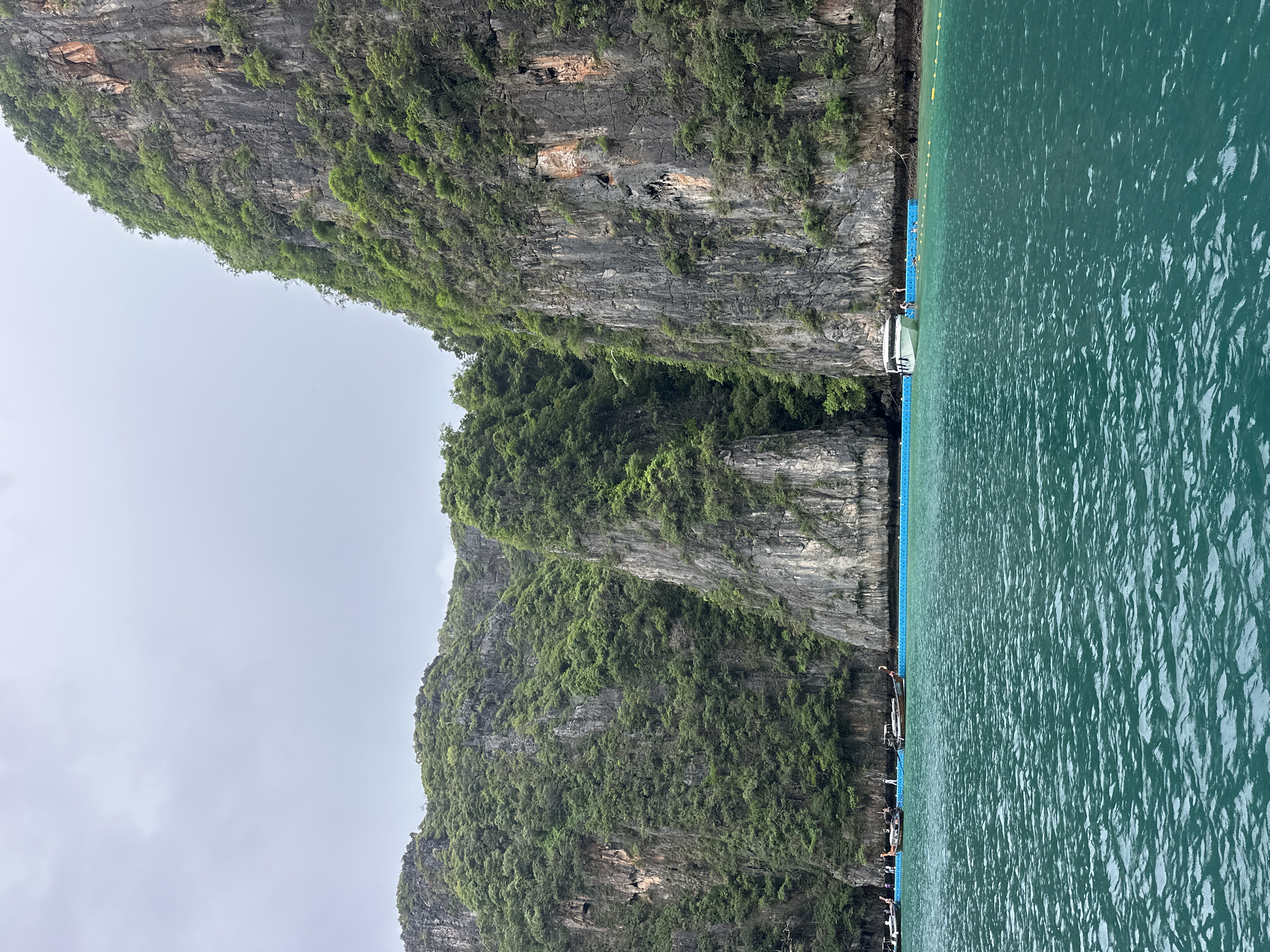 Dawn boat tours navigate Ao Nang's limestone cliffs