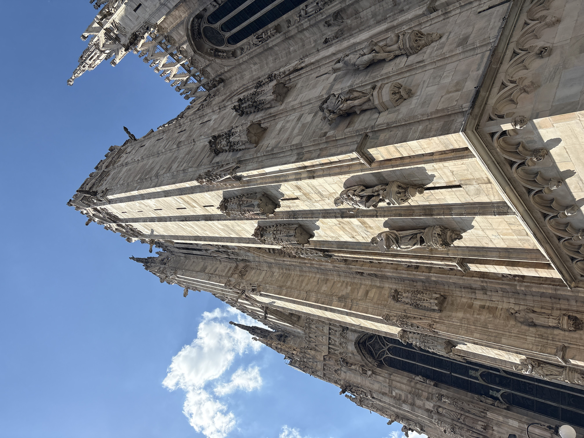 Tourist documents afternoon stroll through historic Milan landmarks