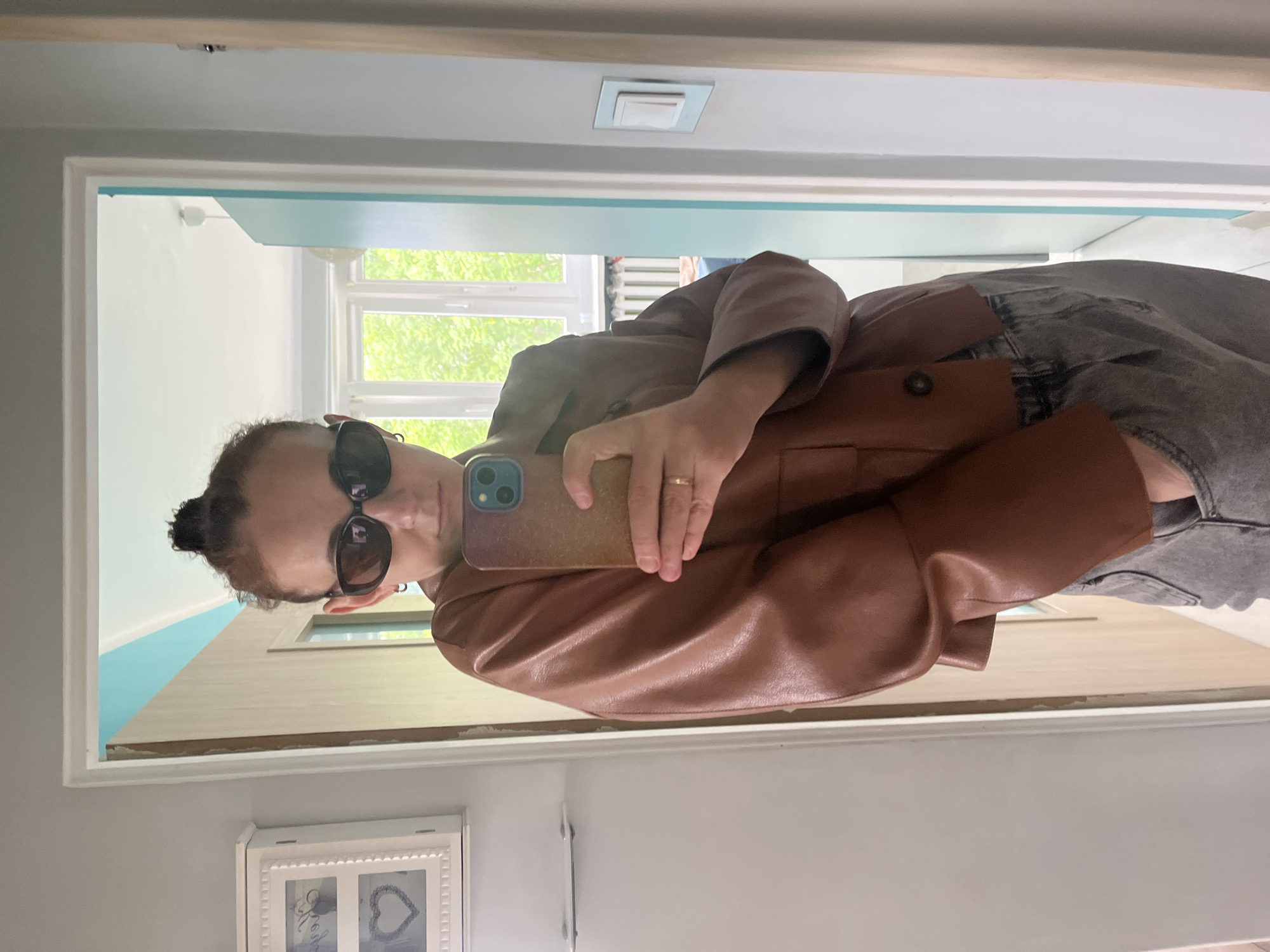 Woman documents afternoon urban walk with selfies and streetscapes