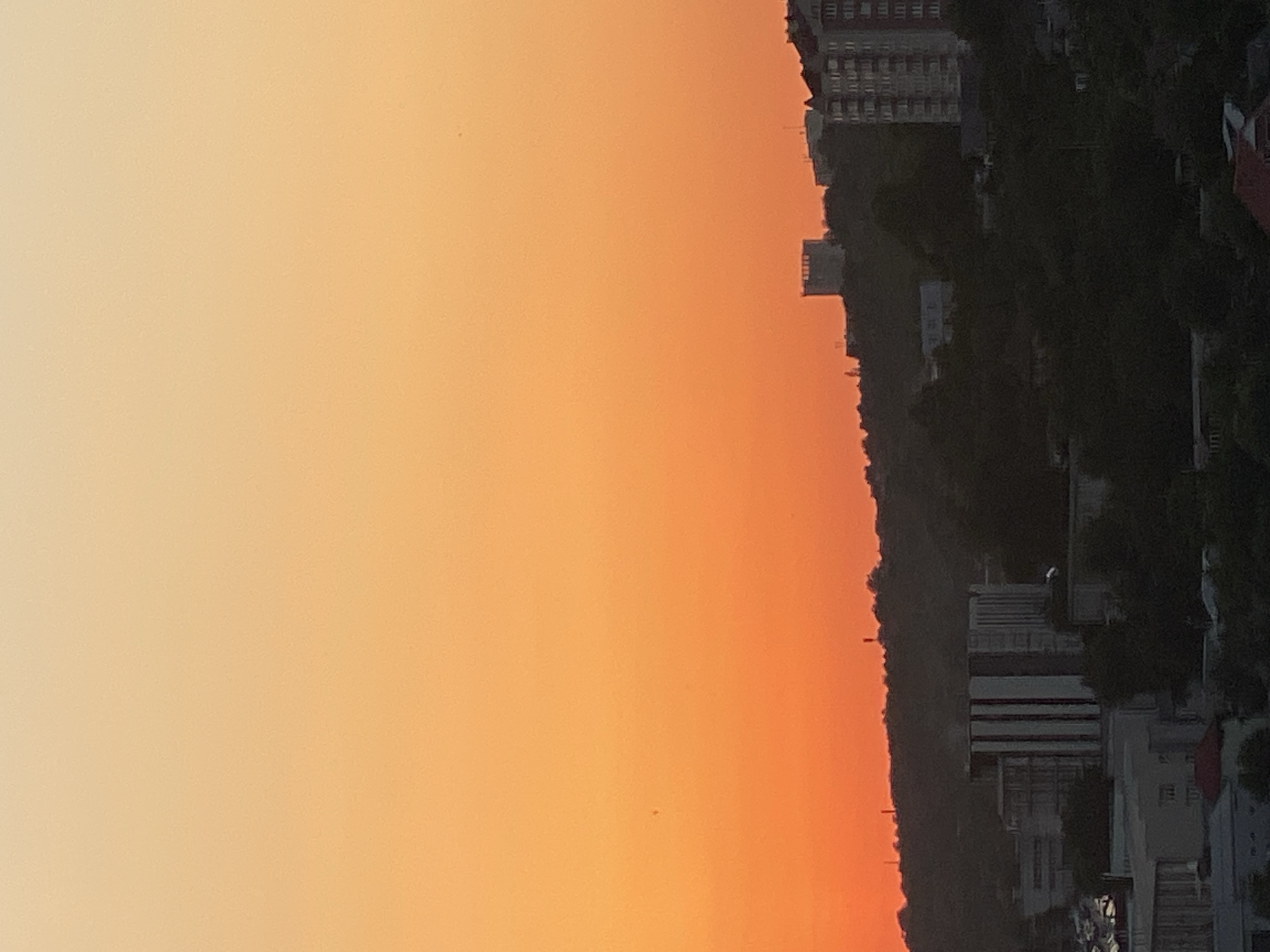 Chișinău sunset watched from above, city sprawling below