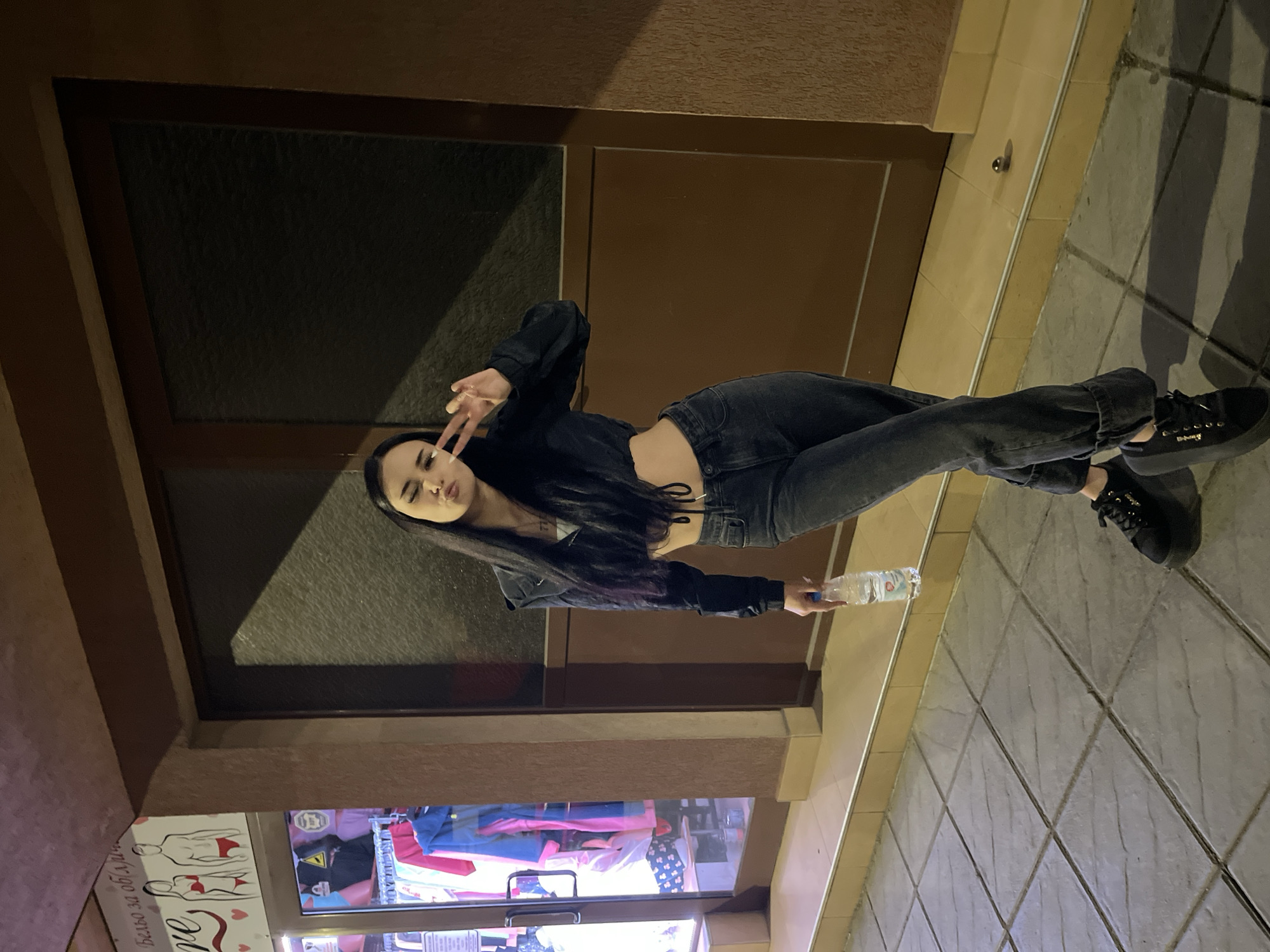 Young woman documented in evening street scenes in Elin Pelin