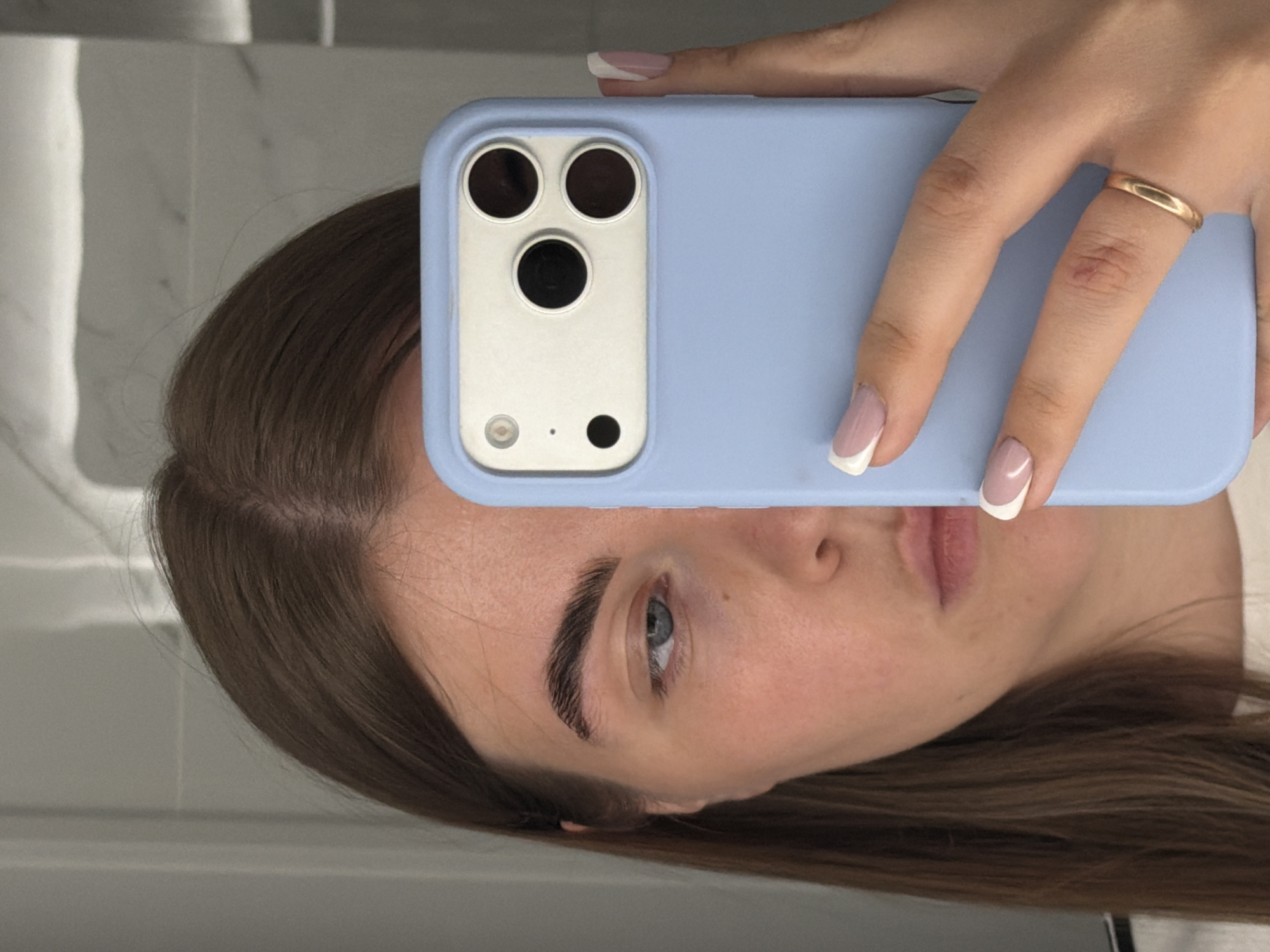 Woman takes bathroom selfies while getting ready in Russia