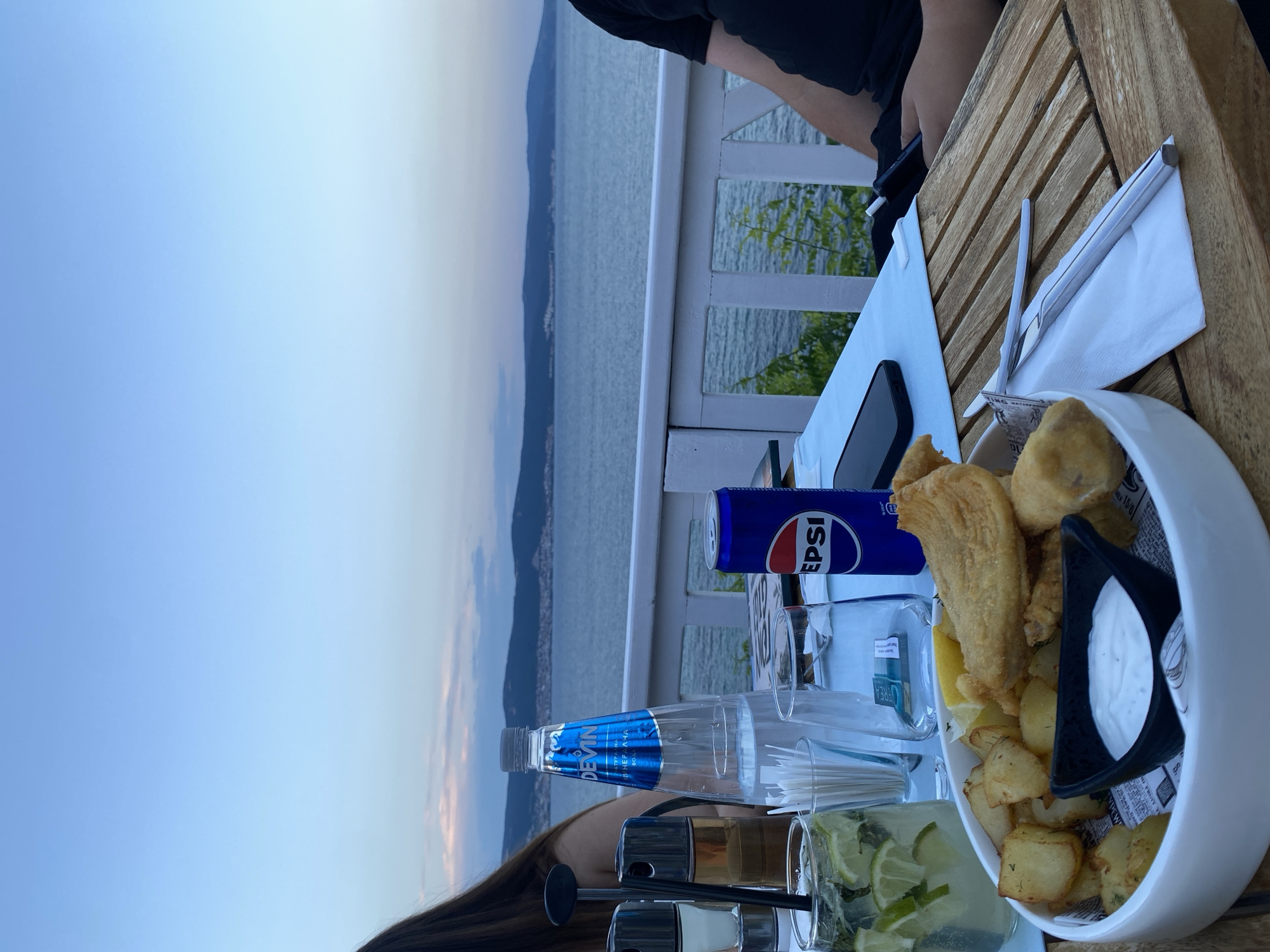 Fish and chips at a breezy seaside table