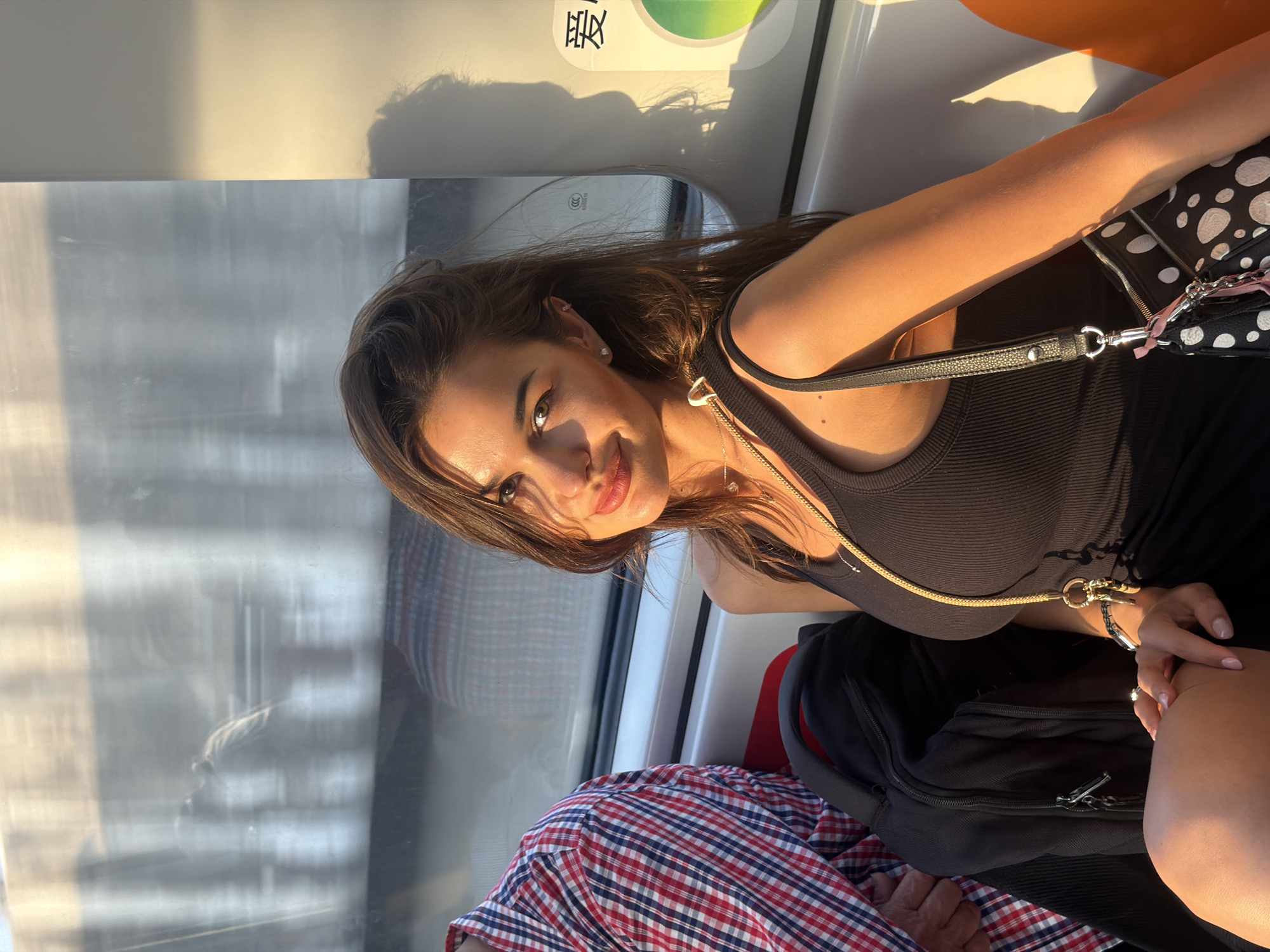 Woman rides train through Pudong district in morning commute