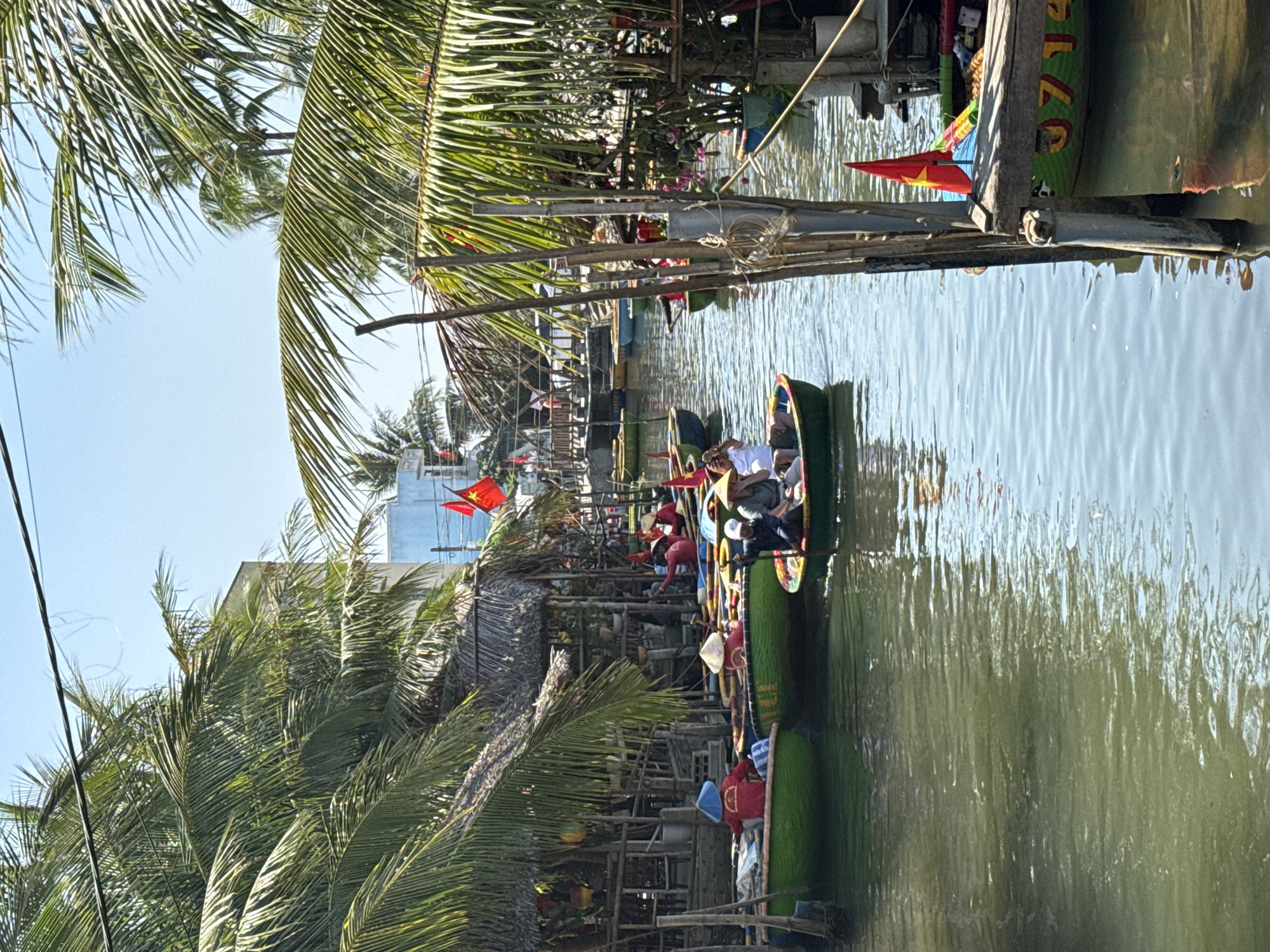 Colorful traditional coracle boats docked in Đà Nẵng waterway