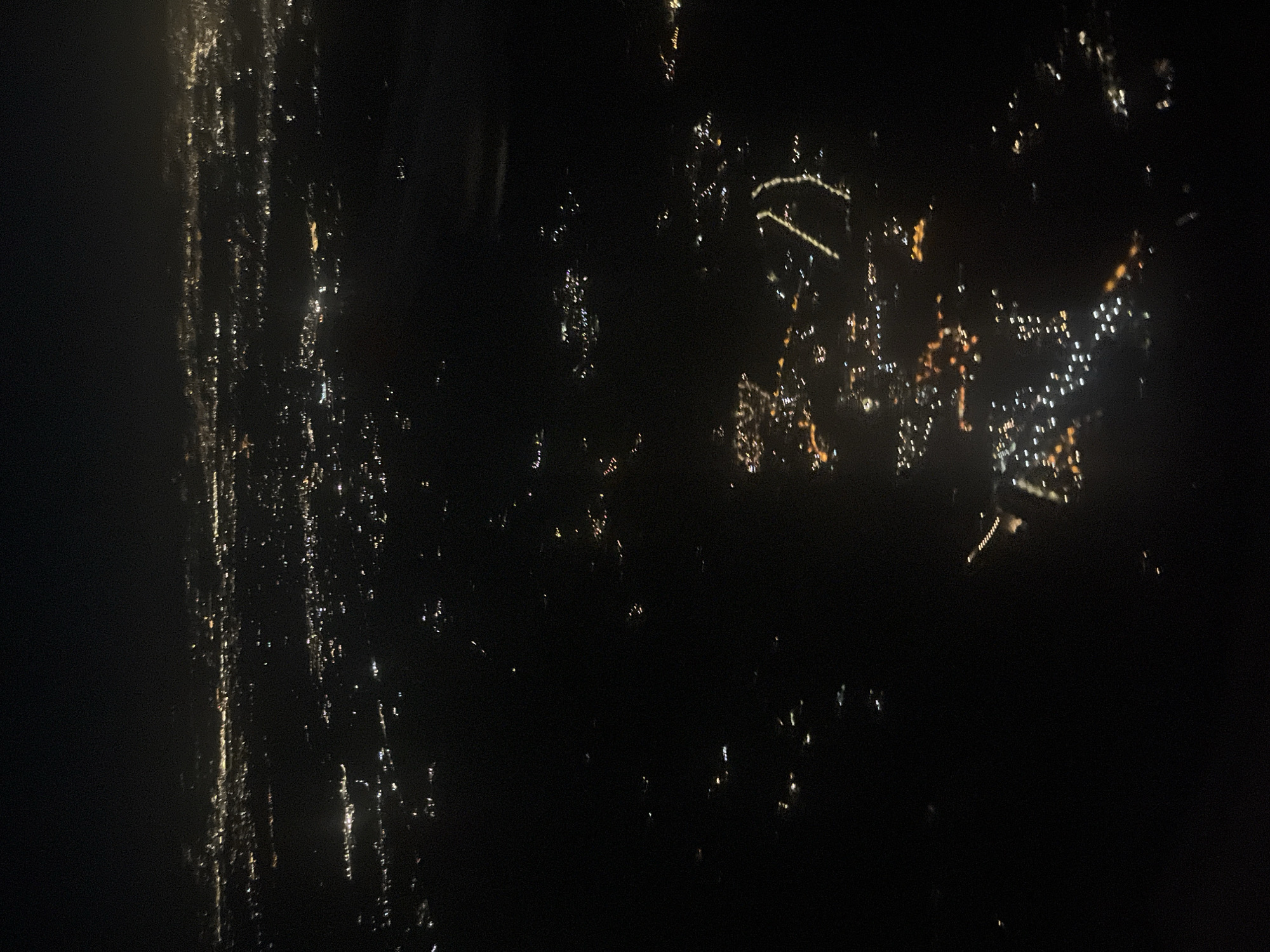 Nighttime aerial view captures city lights in Trevignano Romano