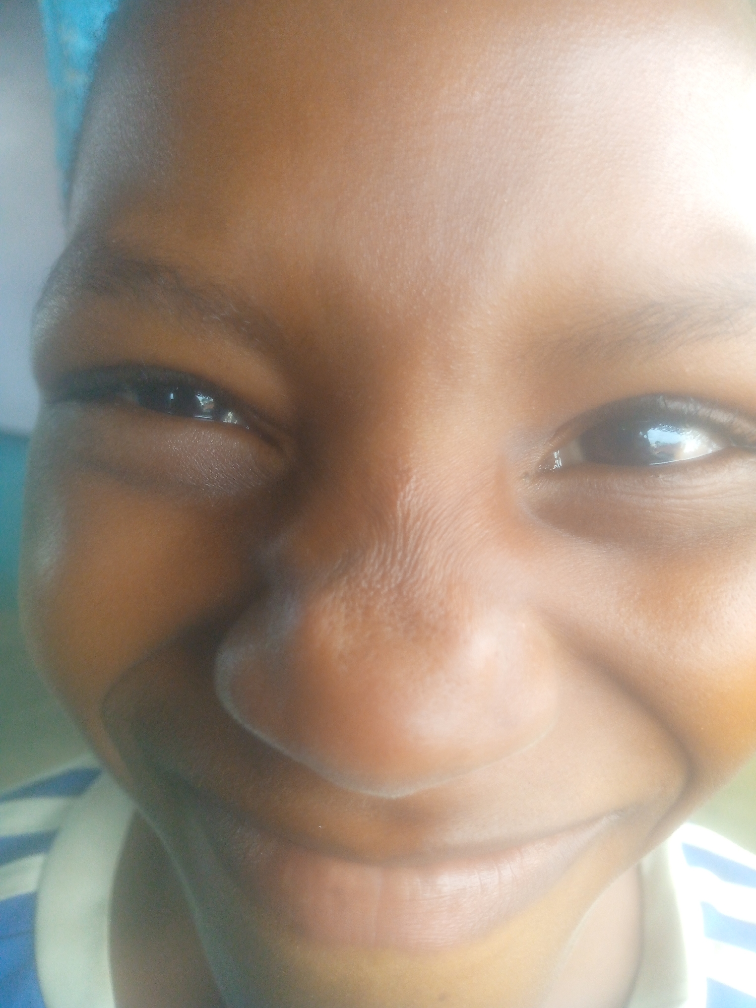 Children photographed in indoor community setting during morning hours