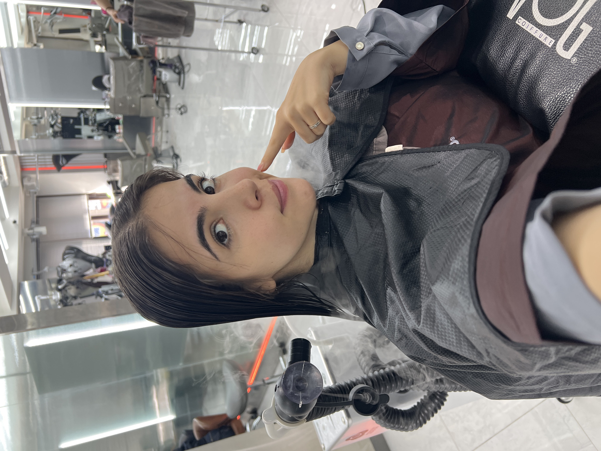 Woman receives hair treatment at Seoul salon early morning