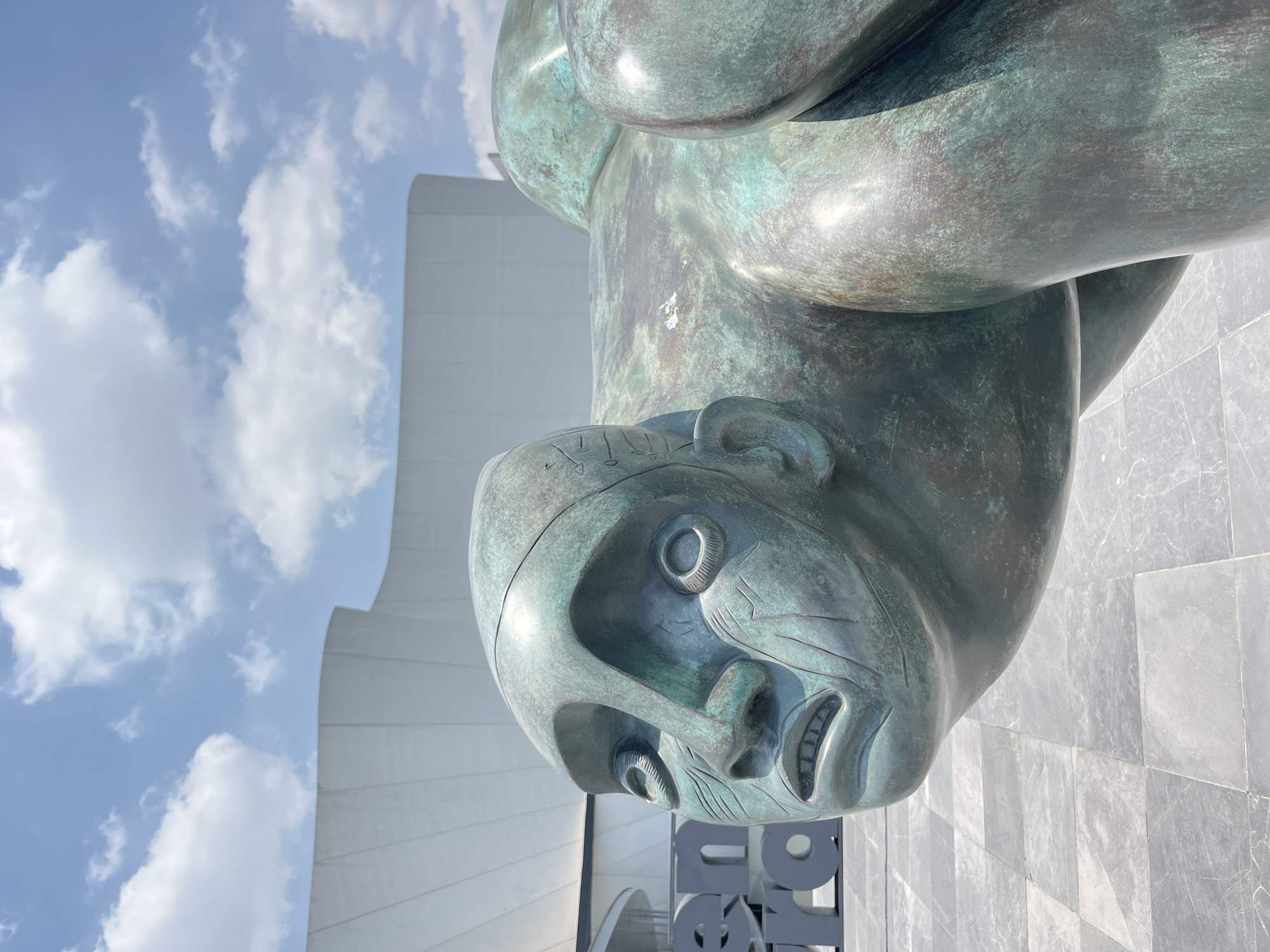 Visitor documents baroque museum's modern architecture and bronze sculptures