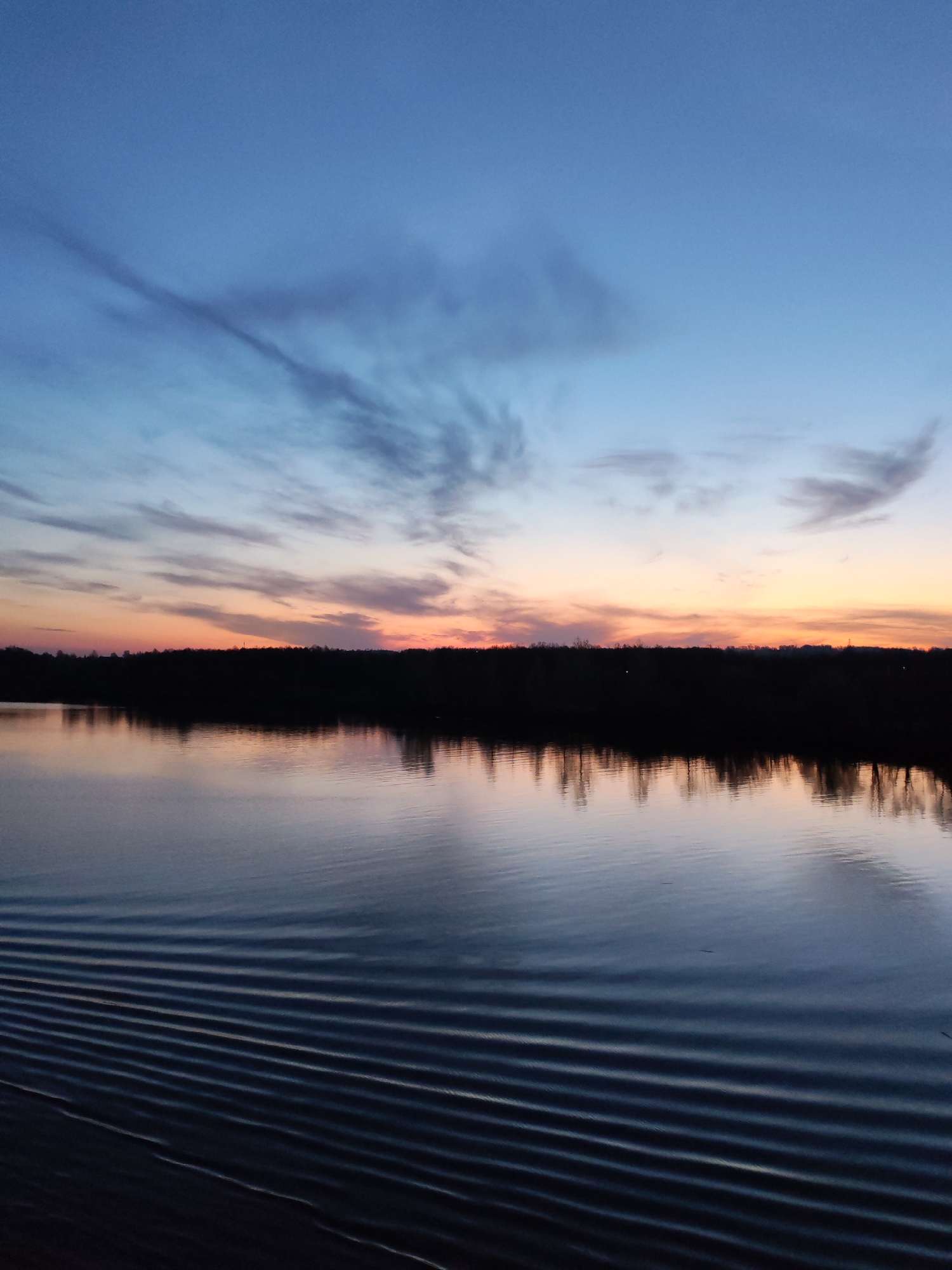 Witness documents peaceful river scene at dusk