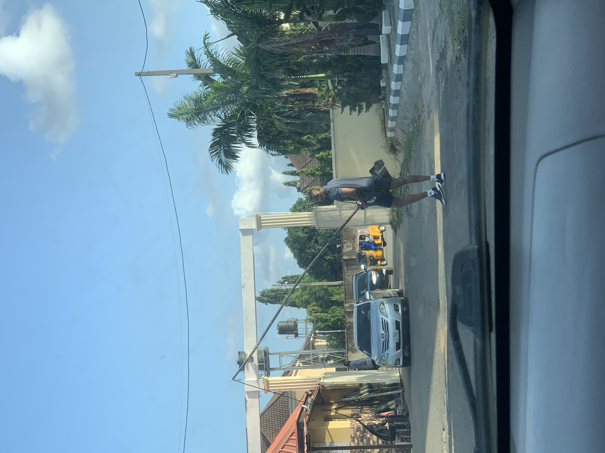 Everyday street life along a busy Abuja road