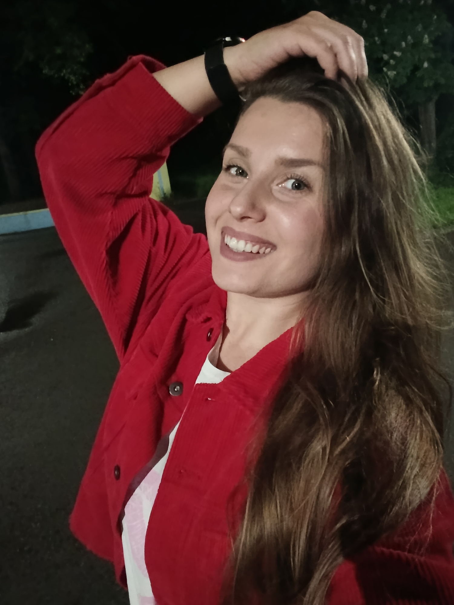 Woman poses for photos in nighttime Targovishte park