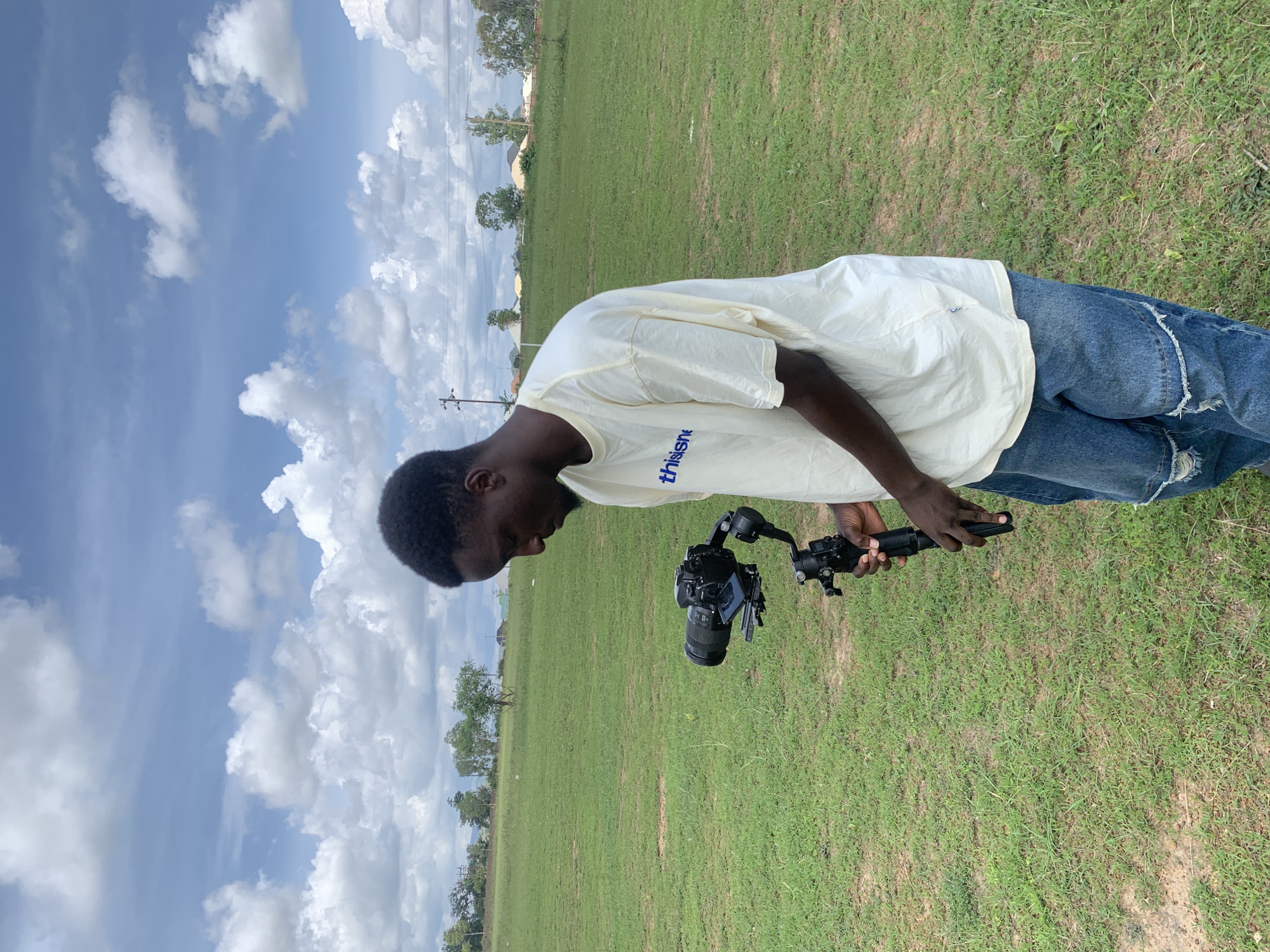 Camera crew works an open field shoot in Jos, Nigeria