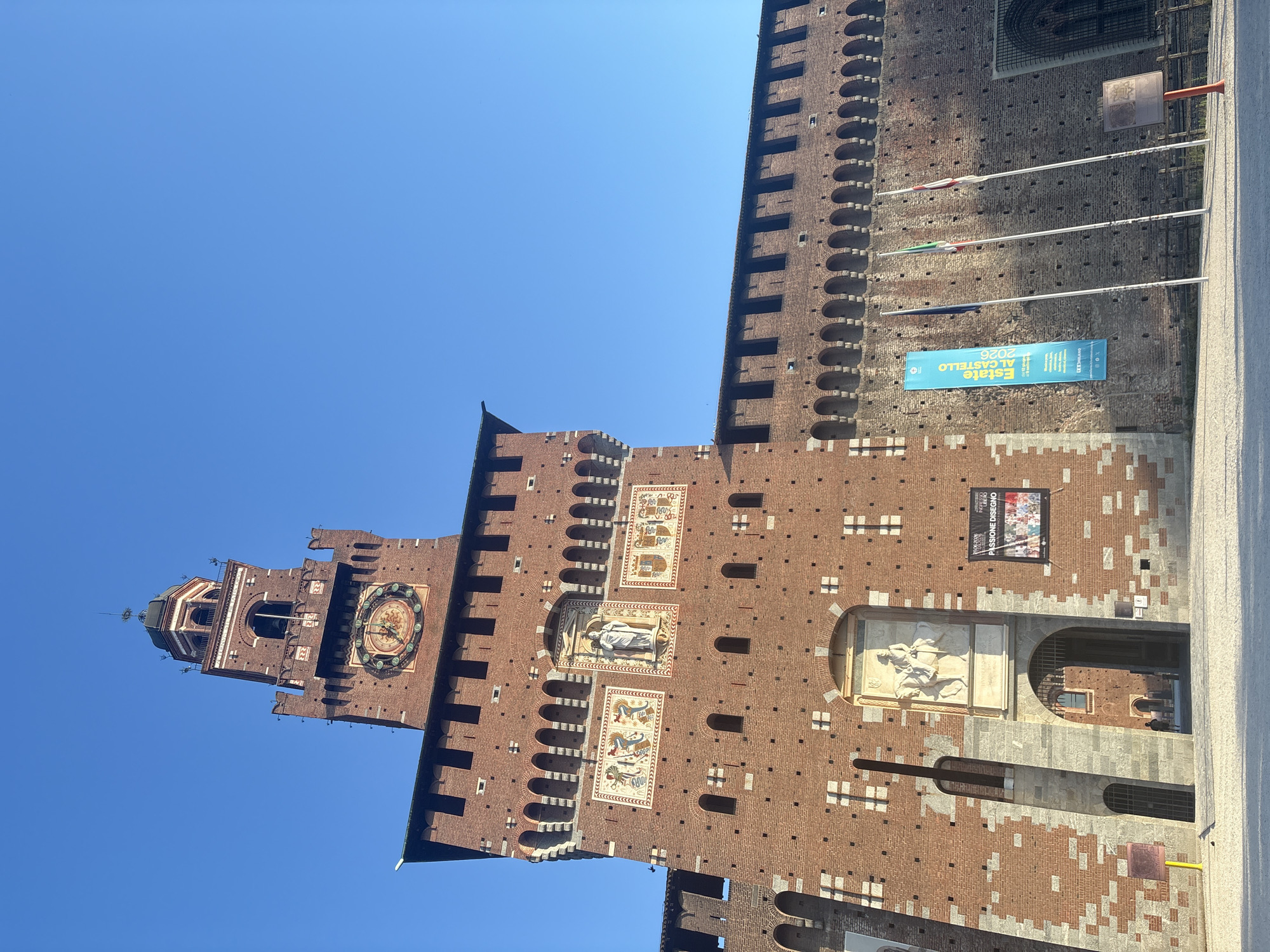 Sforza Castle and park fountain on a clear Milan morning