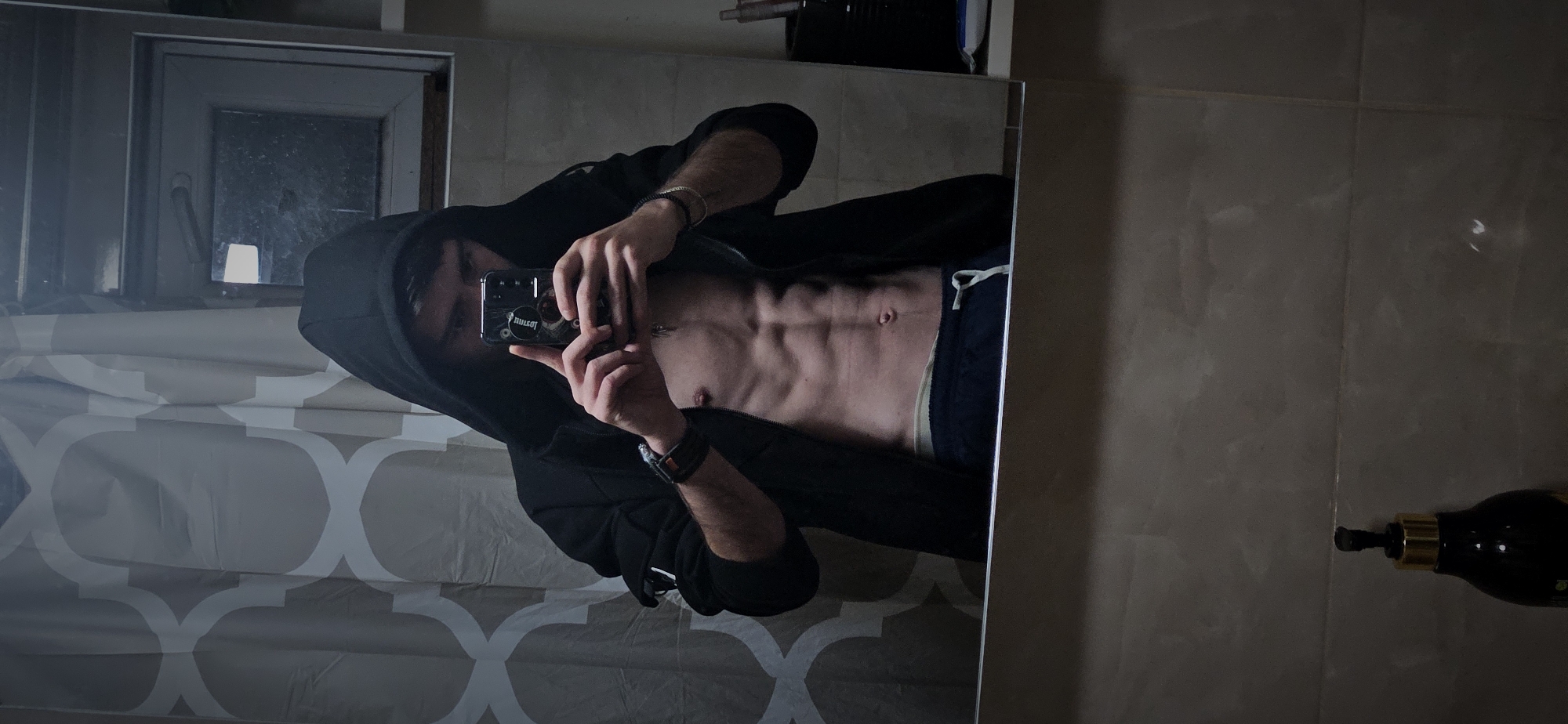 Person takes series of mirror selfies in Kostenets home