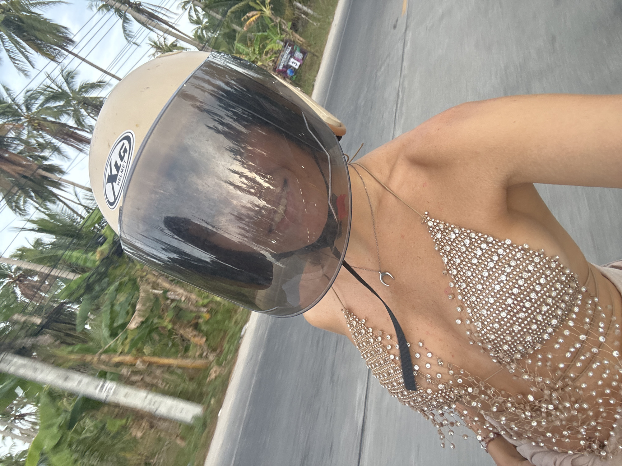 Woman in beaded top spotted on road in Thailand