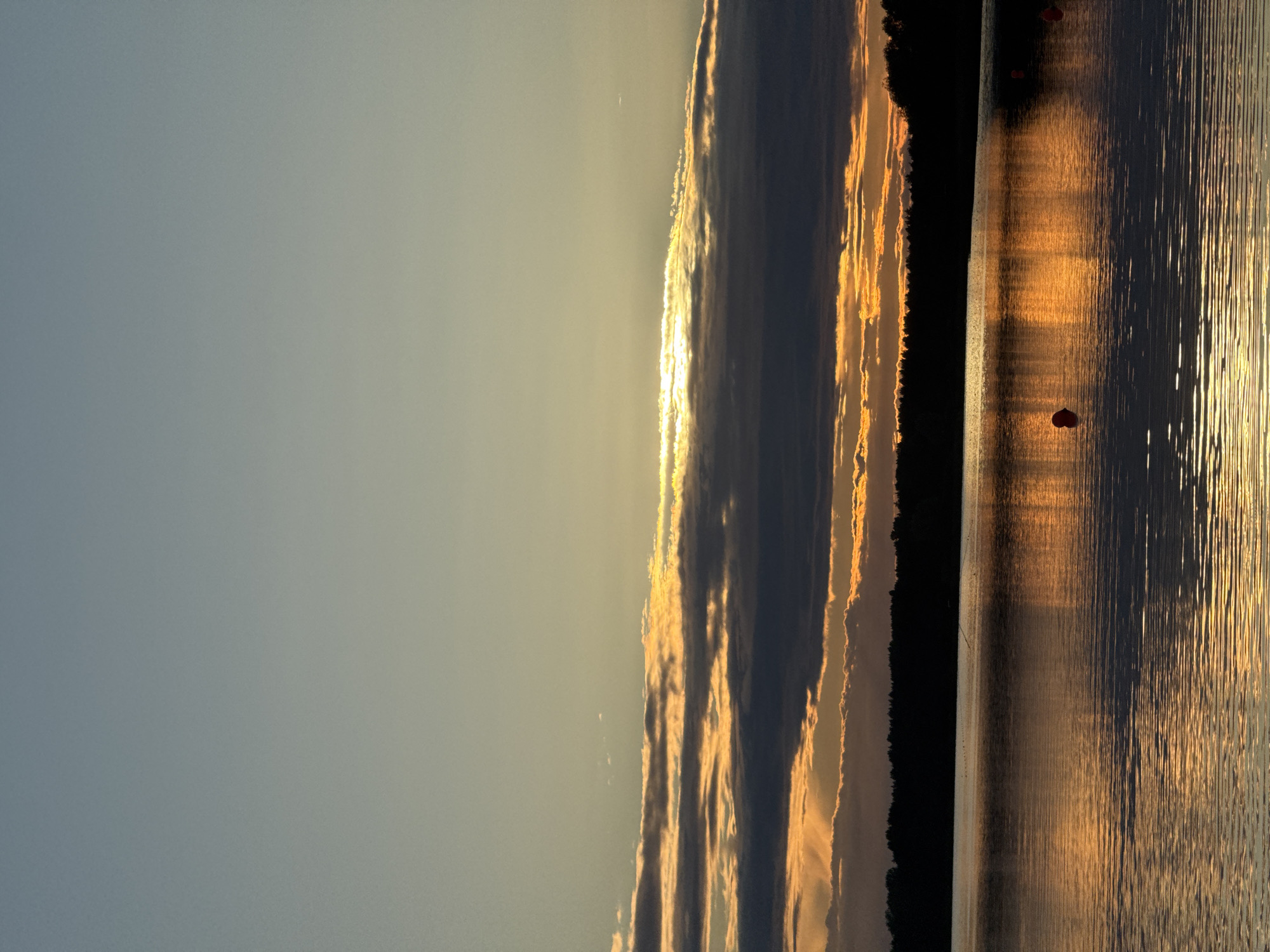 Sunset gathering at Tallinn lakeside dock with fishing and photos