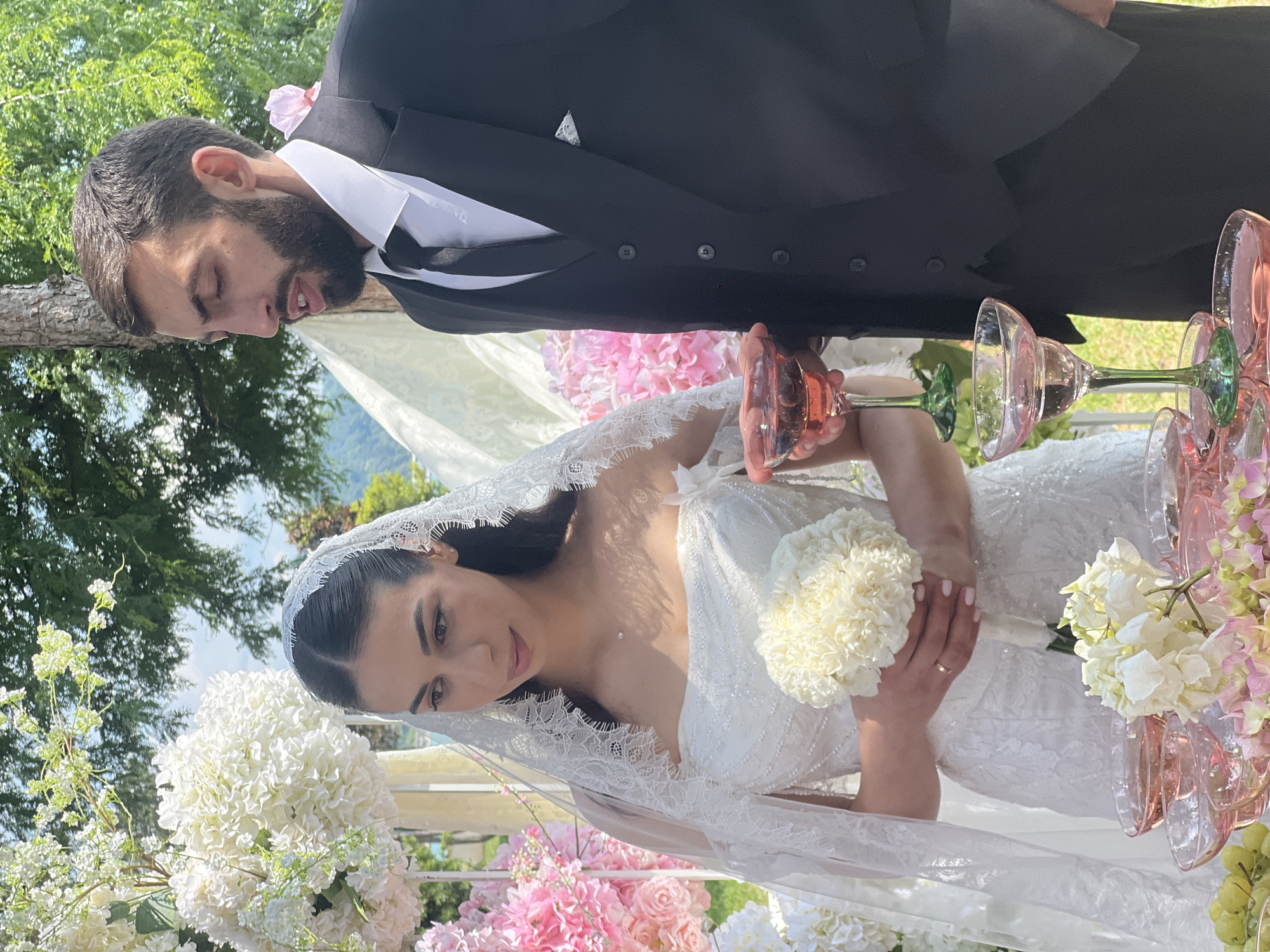 Outdoor wedding ceremony and reception held near waterfront location