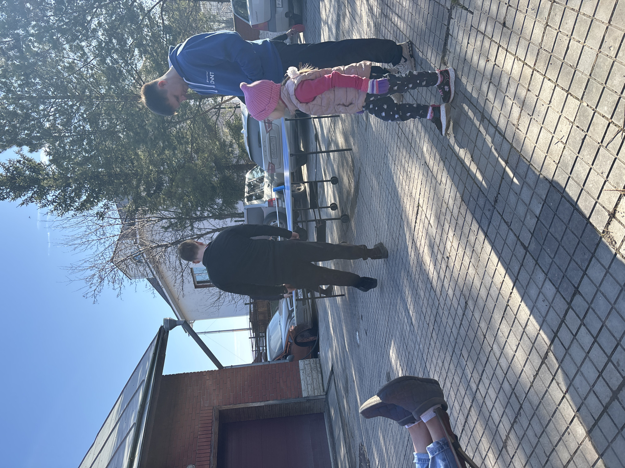 Family ping-pong gathering in sunny Ferma, Russia