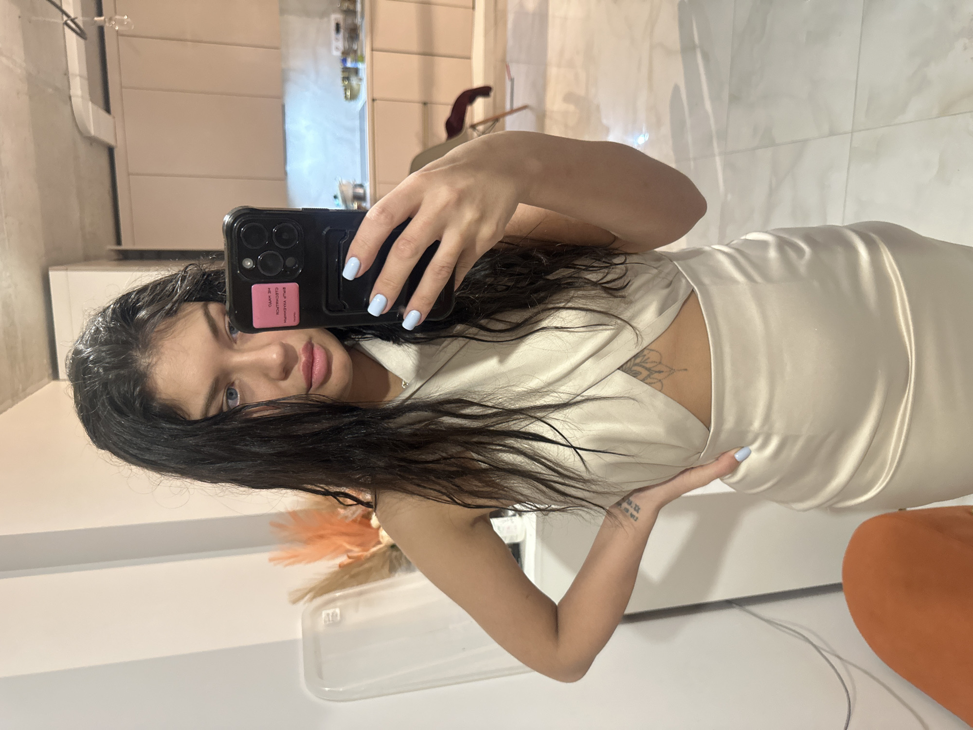 Woman takes mirror selfie at home in Khimki