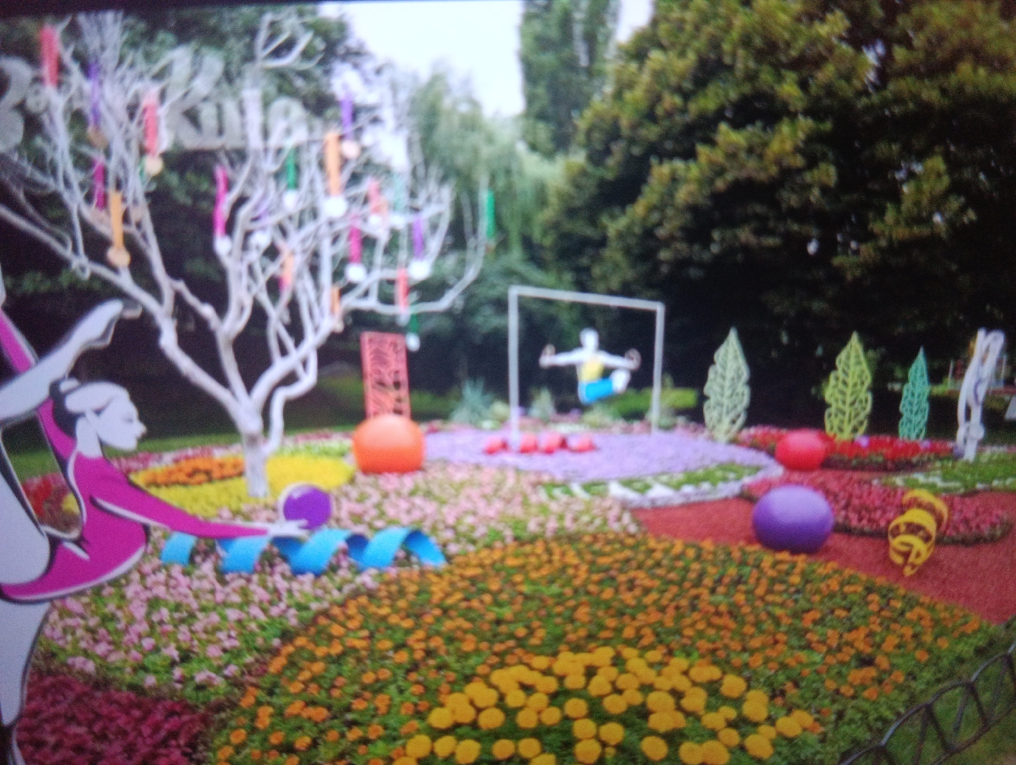 Whimsical topiary park with pop culture and animal sculptures