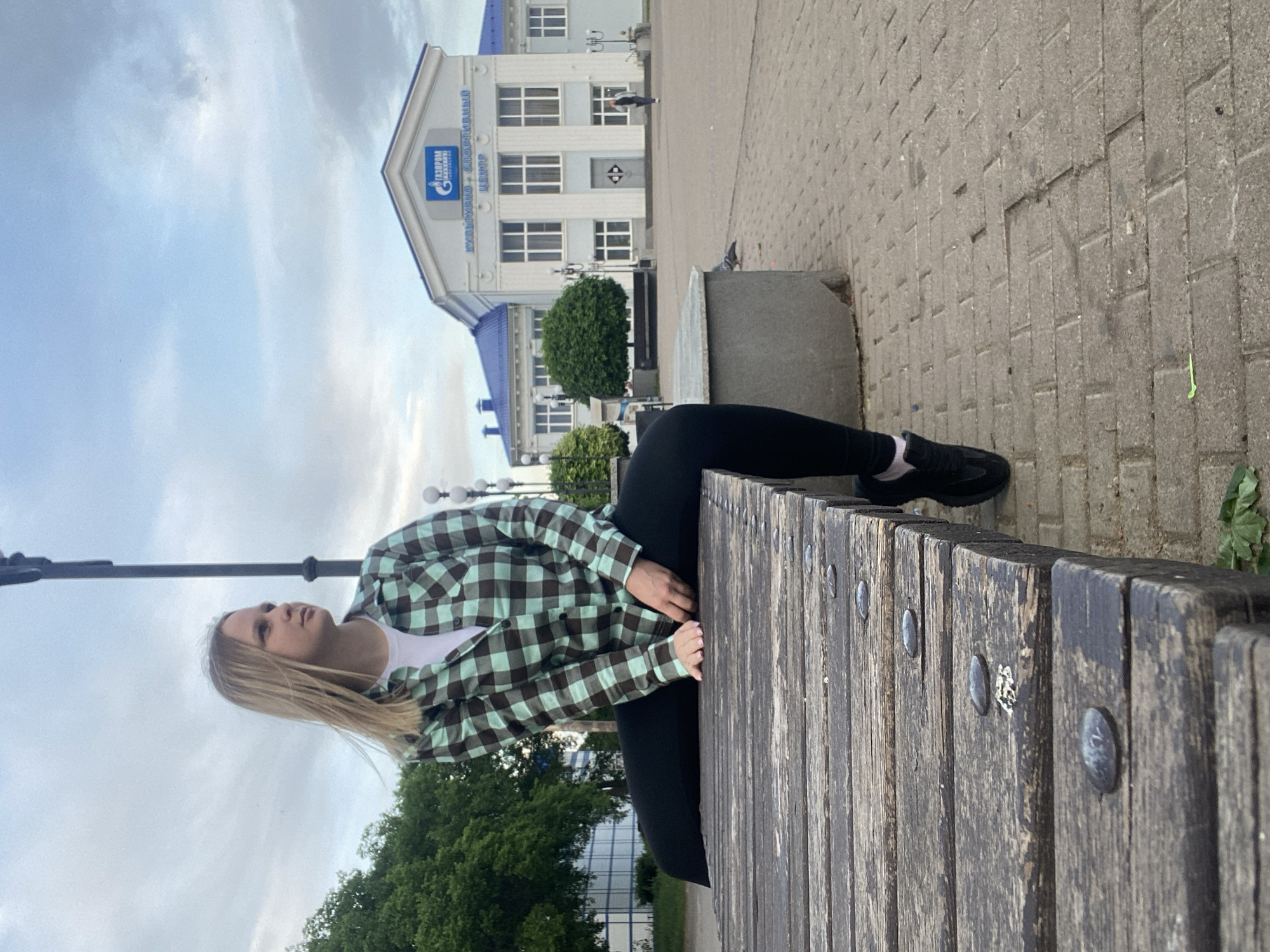 Afternoon gathering in Chaikovsky square with pigeons and fountains